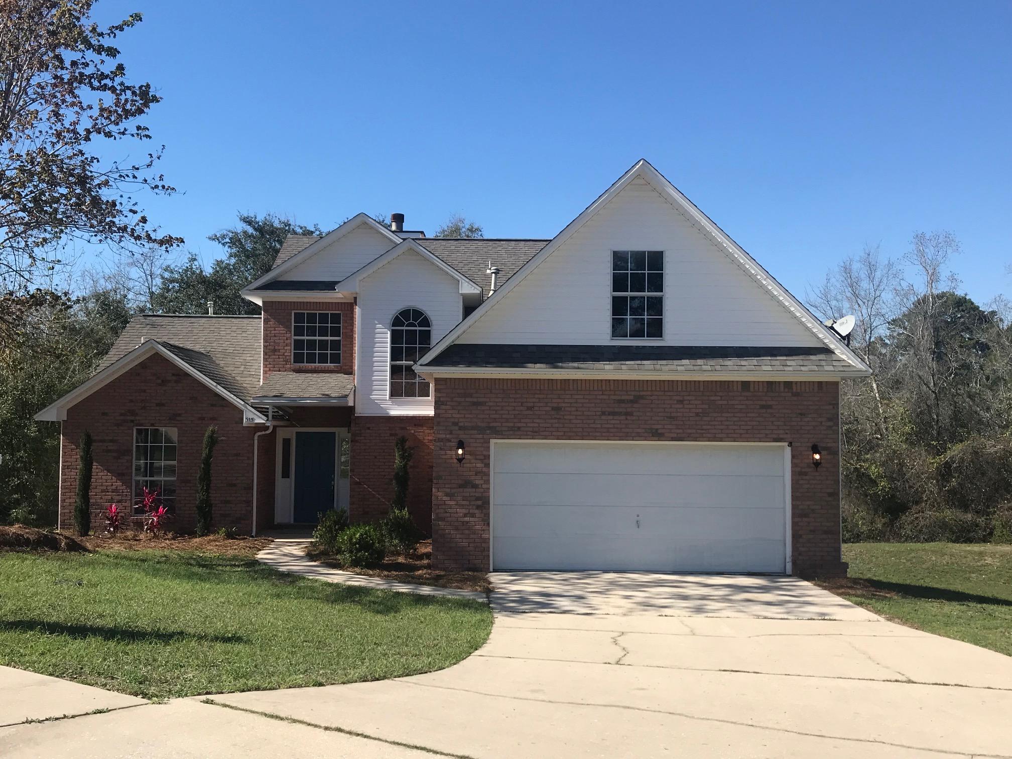 As you walk up to the porch, you will notice fresh landscaping accenting this beautifully 2017renovated home. Entering through the front door, the foyer opens up to your expansive living room complete with brand new laminate flooring and a wood-burning fireplace with unique, floor-to-ceiling accent stones and a granite hearth with dark wood mantle. There is a half bath to your left and the stairs are on your right. The living room open to the dining room and leads you around to the breakfast nook, laundry, office/flex room space with access to the back deck, garage entrance, and your kitchen. Brand new granite counter tops, brand new espresso colored cabinets, brand new garbage disposal, and all new stainless steel appliances - refrigerator included. Off the living room is your master suit with vaulted ceiling, brand new carpet, and three large windows letting in ample natural light. The master bathroom has brand new tile flooring, a garden tub, brand new separate shower with rain-water shower head, double vanity sinks, separate commode area, and a large walk-in closet. Back out into the living room and up the stairs are your three additional bedrooms with brand new carpet, and full bathroom with a shower/tub combo. The backyard has a large, open deck and a perimeter fence.