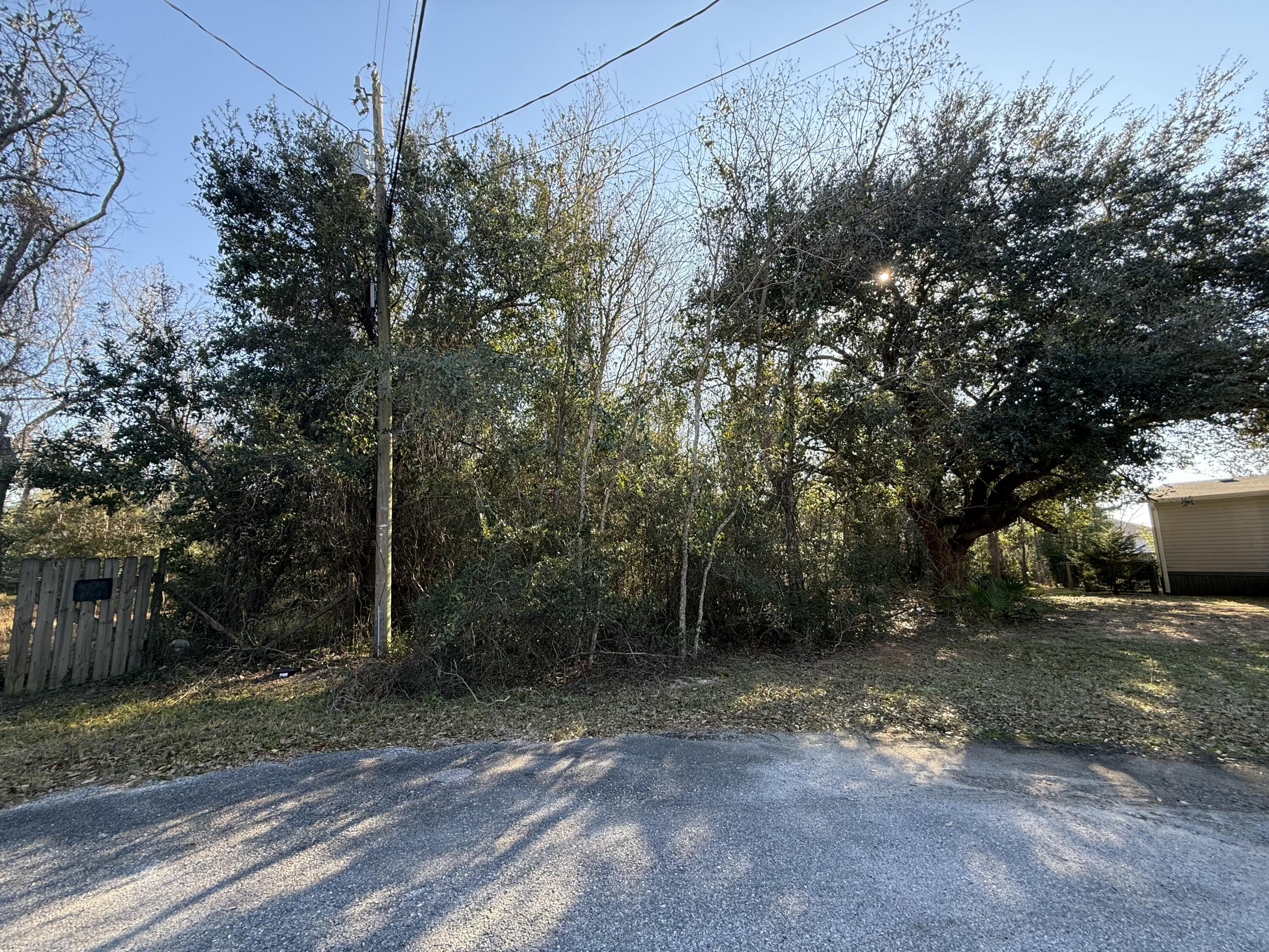Own nearly a full acre in beautiful Gulf Breeze and bring your vision to life. This spacious parcel offers endless possibilities; perfect for building a custom coastal retreat, creating an investment property, or holding for future growth in a highly desirable area. Enjoy the ideal blend of privacy and convenience, located less than four miles from public beach access, with quick trips to sugar-white sands, emerald waters, and stunning sunsets. A rare opportunity to secure your own piece of paradise.

Back on market to no fault of the seller!

-Public Water & Electric are available

*Buyer to verify all measurements
*Property is 0.89 acres per Santa Rosa  Property Appraiser