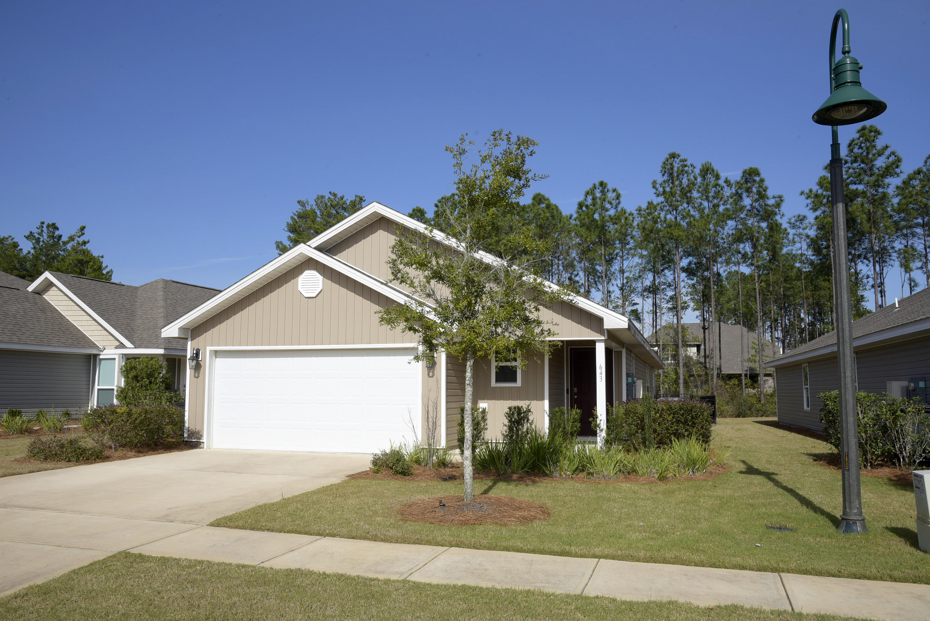 Highly desirable Hammock Bay home! This 3/2 home offers an open kitchen/living floor plan. Kitchen features stainless steel appliances (ice maker not warranted), pantry lots of counters & cabinets for all your cooking needs. There is even a breakfast bar that will easily seat 3 people. The living area has double french doors that lead out to a screened in back porch to enjoy your morning coffee and enjoy the manicured back yard. This home is part of Crescent Mills HOA which is a Maintenance Free Community which includes lawn service. This service includes Mulch, Fertilizer, Irrigation and weekly mowing. The grand master suite is located in the back of the home off of the living room. Master Bathroom has double vanity, walk in shower and a large walk-in closet. 2 guest bedrooms and hall bath offer extra space for guest and family. Indoor laundry room (washer & dryer included but not warranted)and large garage round out this fine home. Hammock Bay Community offers amazing amenities including access to all pools, 24 hour gym, clubhouse, movie theatre, tennis and basketball courts & playground. Owner will consider one small dog. Any dog must be spayed/neutered, housebroken & current on all shots. Requires a non refundable pet fee. NO smoking. Any person 18 years old or older must apply separately. Tenants required to carry renter's liability insurance.
