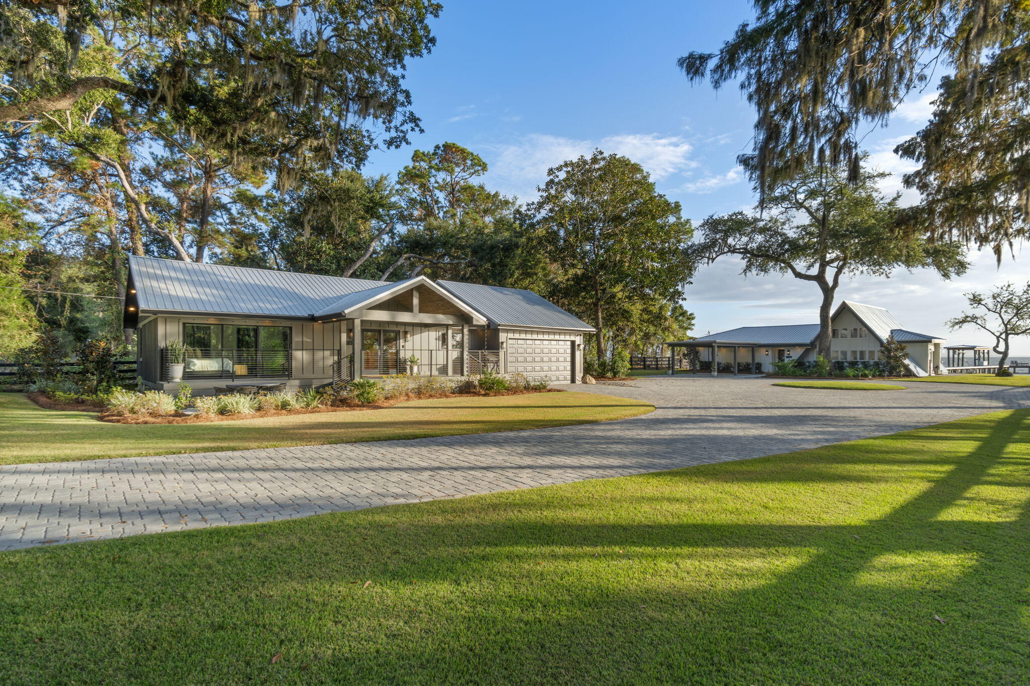 Words cannot describe everything about this property!  This waterfront listing features 2 completely updated homes that sit on .75 acres.  At the front of the property is a 1252sf, 2 bed/2 bath historic cottage which was transplanted from Freeport; the other is a 1635sf, 2 bed/2 bath A-Frame w/loft, that sits on the water.  Enjoy gorgeous sunsets and amazing views from both homes.  Impressive, paver brick driveway, patios, firepit and the pathway to the boat dock.  Some of the updates include all new plumbing in both houses, new water heaters, drywall, paint, siding, new sliding doors in the A-frame, new vanities in all bathrooms, new lighting fixtures; both exterior and interior, all new plumbing fixtures, flooring and appliances in both houses.  (See Full list in the Documents Section). Pavers, landscape, irrigation, dock, boat house, boat lift, dock box, cleaning station, ladder, flow through decking, snap jacket pilling.  A whole house generator on one house and generator hookup for other, a plug in stand by generator included.