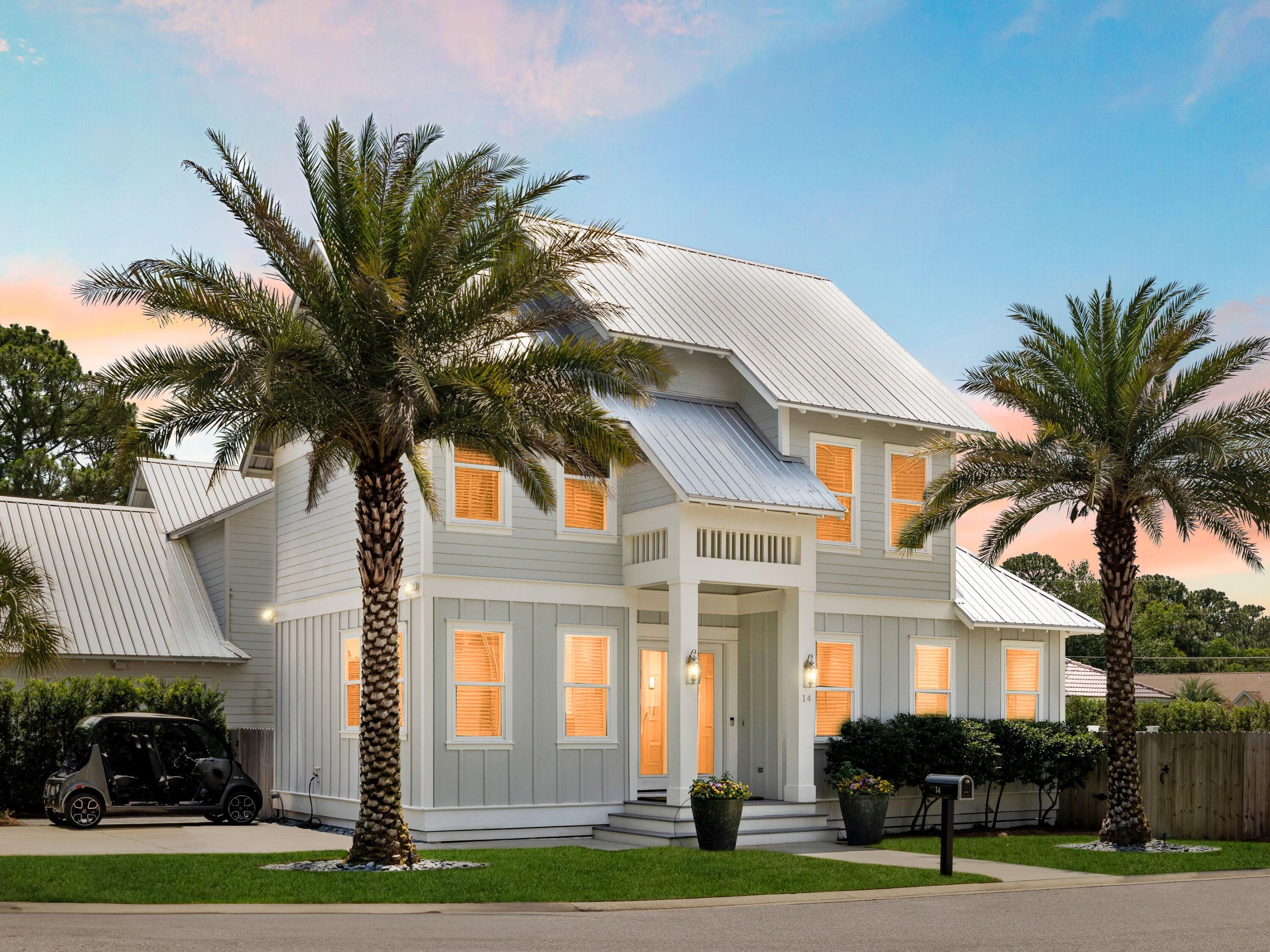 This beautifully crafted beach home strikes the perfect balance between polished sophistication and laid-back Gulf Coast comfort. Located in the heart of Miramar Beach, just over a mile from the sand and minutes from the bay, this two-story retreat offers enviable access to the best of both shores—with golf cart convenience to local favorites like the Silver Sands Outlets and Destin Commons.

Built in 2019 and recently refreshed with new paint, the home features four spacious bedrooms, including two primary suites—one on each floor—offering flexibility for multigenerational living or rental versatility. The open-concept layout is anchored by a striking kitchen where white cabinetry, quartz countertops, under-cabinet lighting and a waterfall-edge island set the tone for elevated everyday living. Wide-plank hardwoods span both levels, complemented by custom tilework and natural light that spills into every corner of the home.

The upstairs master offers a private sanctuary with an ensuite bath and separation from the two additional guest rooms. A well-placed laundry room completes the second floor. Outside, the fenced backyard is an open invitation to linger whether on the raised deck, paved patio, or among the lush landscaping.

A thoughtfully-designed coastal retreat with ample parking make this home a smart buy for investors and beach lovers alike. With no carpet, no compromises, and no need to choose between the bay or the beach, this home captures the full coastal lifestyle, no matter which way you ride.