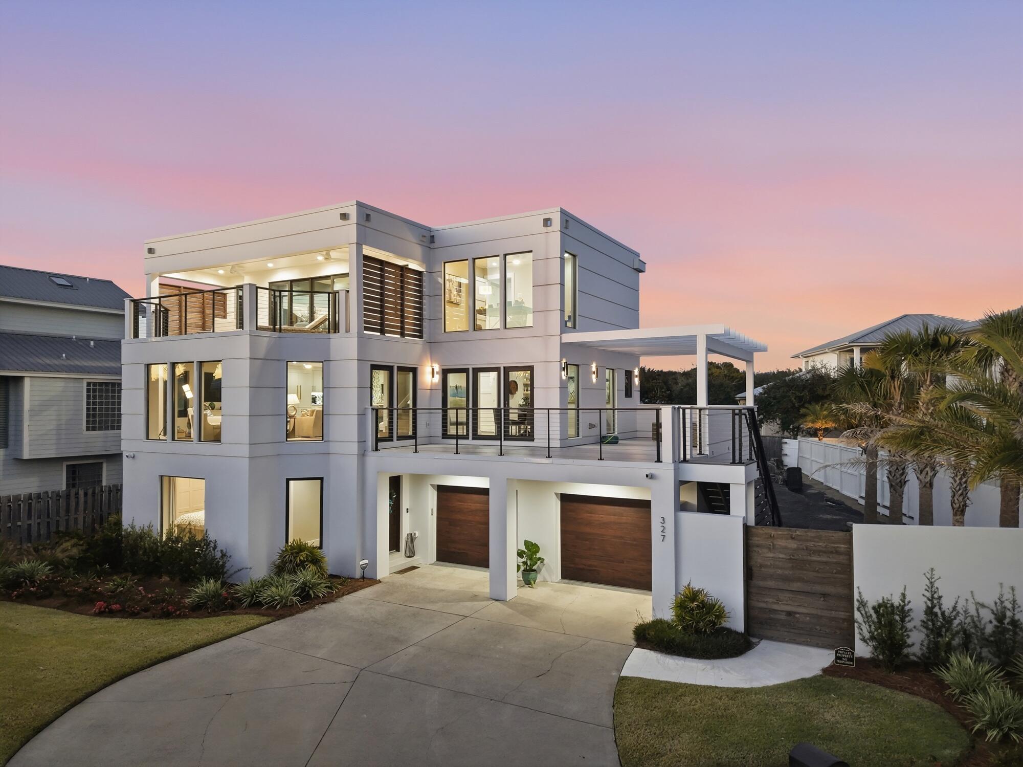 Poised within the non-rental, gated community of Sand Cliffs along iconic 30A, 327 Sand Cliffs Drive embodies refined coastal living with architectural intention and modern luxury at every turn. Completely remodeled down to the studs, this 3,039-square-foot residence presents three bedrooms, two-and-a-half baths, an elevator, and thoughtfully designed living spaces that elevate daily life. A curated blend of craftsmanship and comfort defines the interiorhighlighted by a Thermador range for culinary excellence, dedicated office space, fitness room, additional laundry in primary bath, and a whole-house dehumidifier and generator for peace of mind. Expansive windows and outdoor living areas invite natural light and Gulf breezes, while upper-level decks frame sweeping Gulf views, including from the primary suite, which also offers private outdoor lounge space.

Set on a generous lot, the property provides exceptional opportunity with room for a pool and carriage house, extending both lifestyle and value. Outdoor living continues with a spacious deck ideal for gathering and relaxation, complemented by convenient neighborhood beach access just moments away.

From morning coffee overlooking the water to evenings spent exploring nearby Alys Beach dining and boutiques within walking distance, this home places the essence of 30A living at your door. Elegant, resilient, and beautifully reimagined, 327 Sand Cliffs Drive is a striking expression of design, comfort, and coastal sophistication.