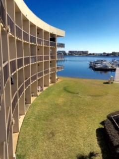 *MILITARY = $900/MO.* 7-12 mo. Lease. AVAIL: 6/24. FULLY FURNISHED 3RD FLOOR WATERFRONT STUDIO CONDO W/ KITCHENETTE! Carpet & tile flooring. Queen bed & twin day bed trundle w/ pull out twin bed underneath. Dining table w/ 2 chairs. Balcony w/ 2 chairs & table overlooks the GORGEOUS WATERVIEWS, boat dock/slips, MICKEY MOUSE shaped swimming pool, picnic tables/bbq grills & grassy common grounds. Admire the beautiful sunset glistening over the Intercoastal & the emerald Gulf of Mexico! Close & convenient to EVERYTHING- perfect central location! Washer & dryer on the same floor. 46ft boat slip upon availability w/ an extra fee. ALL UTILITIES & WIFI INCLUDED- EXCEPT FOR ELECTRICITY! 25lb pet policy w/ fee. Great place to feed the ducks, catch a big fish or watch the magnificent sunsets- enjoy! NOTE: Property is also listed for sale, whichever happens 1st. If property rents 1st it will stay on the market for sale & Tenant must cooperate w/ showings w/ a 24 hour notice & new buyer must honor lease agreement.