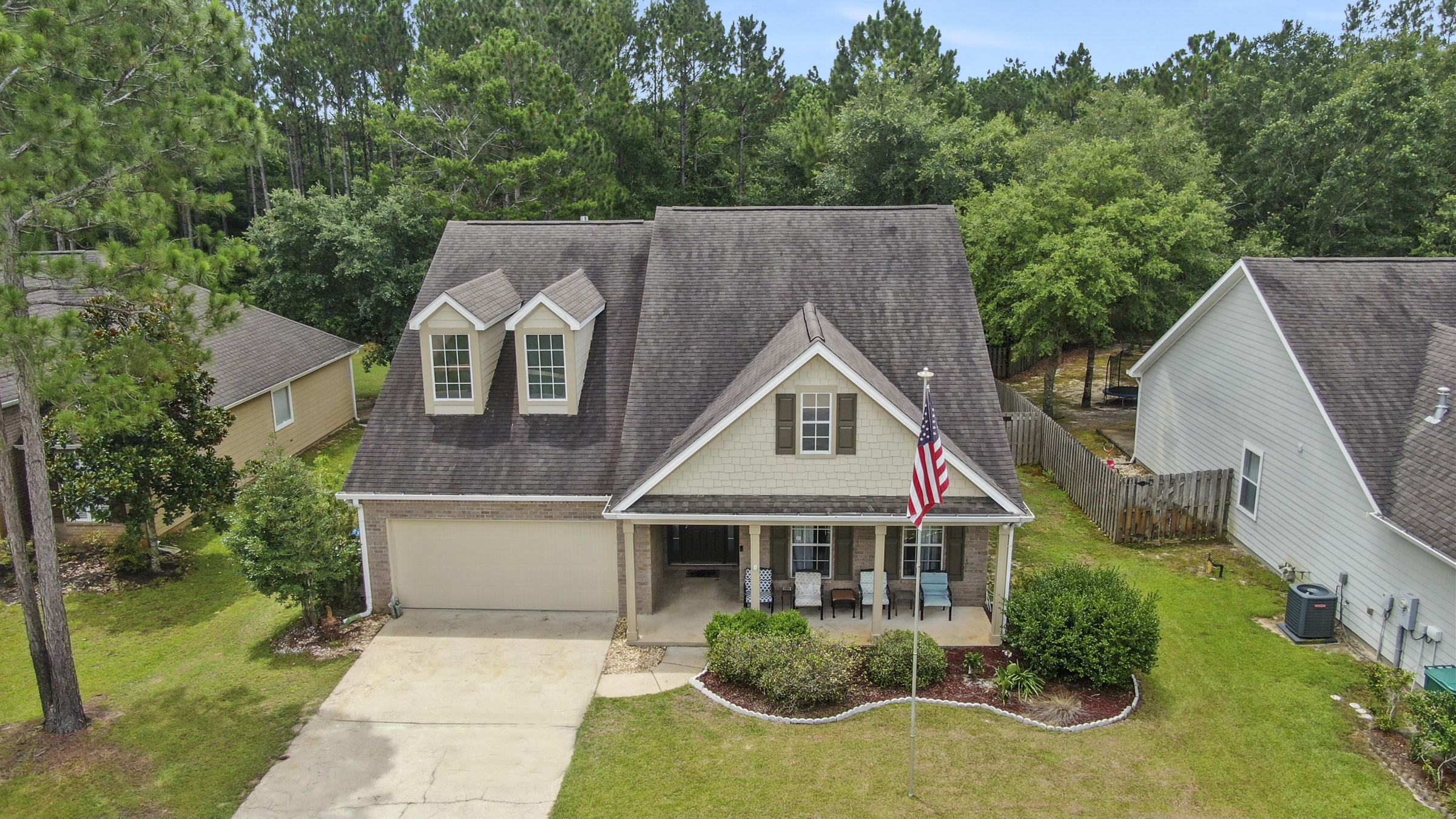 Enjoy the relaxing beauty of nature from the roomy and private deck. Beautifully maintained PRESERVE home nestled in the heart of Hammock Bay now available.Spacious open living room with stunning gas fireplace focal point.Easy to care floors in living areas.Fresh paint inside and out. Kitchen has tons of counter and cabinet space perfect for your culinary creations.Sunny dining area with calming preserve views.Spacious sunroom perfect as second living area or office.Split floor plan offers privacy to Primary bedroom.Oversized Primary bedroom owners retreat and large closet. Primary bath offers double vanity,separate tub and shower.Large secondary bedrooms with new carpet share bathroom between. Screened porch to enjoy nature. 
Hammock Bay Is a planned community with world class amenities