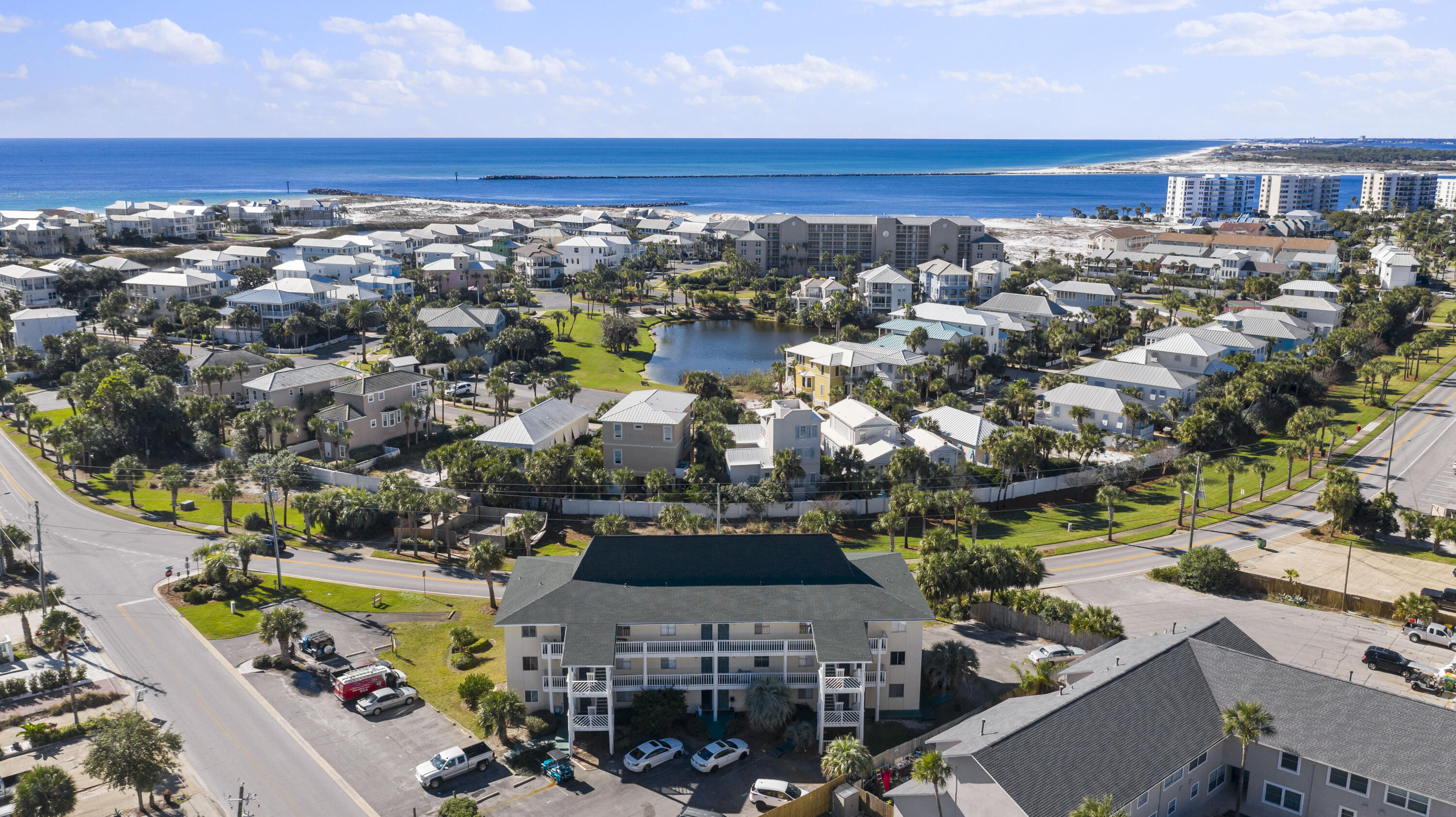 Come enjoy the coastal lifestyle of Holiday Isle! This updated unit is MOVE IN READY! This spacious 1 bedroom, 1 bathroom condo comes fully furnished and is located on 1st floor with a balcony. The unit features granite countertops, new tile floors and solid wood cabinets. You will be walking distance to the community's gated beach access and the inlet of the East Pass at O'Steen Beach. You don't want to miss the seasonal Emerald Grand fireworks from your balcony and access to watersports, shopping and restaurants at the Harbor via water taxi at Norriego Point! LOW HOA dues and amazingly rents short term, long term or utilize it yourself! This unit won't last long!