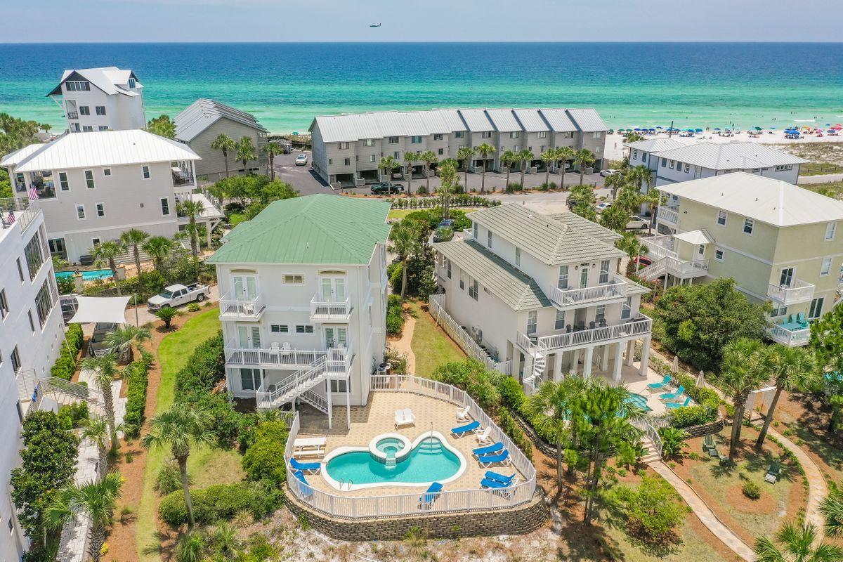 Renovated in 2017, with the exterior painted in May 2020, this amazing home situated steps to the beach and on a lake in Seagrove Beach, FL, is a prime vacation getaway along Scenic 30A with spectacular Gulf views. Projected to gross over $182,000 in rentals. Renovations include: new flooring on 1st & 2nd floors, new furniture in living room and most bedrooms, new lighting fixtures, new kitchen appliances, kitchen countertops and cabinets, four new bathroom vanities, bathroom toilets and hardware, shower doors, outdoor railing on 2nd and 3rd floor decks, 2nd floor deck flooring, driveway pavers, landscaping, paint inside and outside, gutters, and TVs. This home includes a heated pool and spa, two-car garage and Gulf views. Plenty of parking spaces with overflow in the cul-de-sac center. Enjoy gulf views from the large 2nd floor deck and 3rd floor master bedroom's private balcony. When you enter the first floor, there are two guest bedrooms - one with a king bed and the other with two queens. There is a full bathroom with double vanities and Jacuzzi tub/shower, a large owner's closet, and two oversized separate storage closets on the first floor. The two-car garage with additional storage closet is located on the 1st level as well. Up the wood stairs to the second floor, you will find two more guest bedrooms on the back of the home overlooking the lake. Each bedroom has a bathroom and access to the oversized balcony also perfect for an office. A large open kitchen, living room and dining area are located on the front of the home with an enormous porch for outside entertainment and dining as well as Gulf views. The kitchen has a horseshoe breakfast bar, ice maker, and a separate wet bar with wine fridge. There is a full-size washer and dryer on the second floor as well. The top floor has three additional guest bedrooms in addition to the master bedroom on the front of the house facing the Gulf. The master bedroom has a huge walk-in closet, and the master bathroom has dual vanities, a separate jetted tub, and shower. A large private balcony is connected to the master bedroom and has amazing Gulf views. This is a very enjoyable spot to soak in the sun and amazing sunsets! The two rear guest bedrooms have private balconies overlooking the lake behind the home. This wonderful vacation home is located on a quiet cul-de-sac across the street from the Gulf of Mexico and next to Deer Lake State Park. The home comes with hurricane shutters. There is additional common area parking in the cul-de-sac providing plenty of room for all of your guests! The wide, white sandy beaches are just steps away from the home providing easy access.