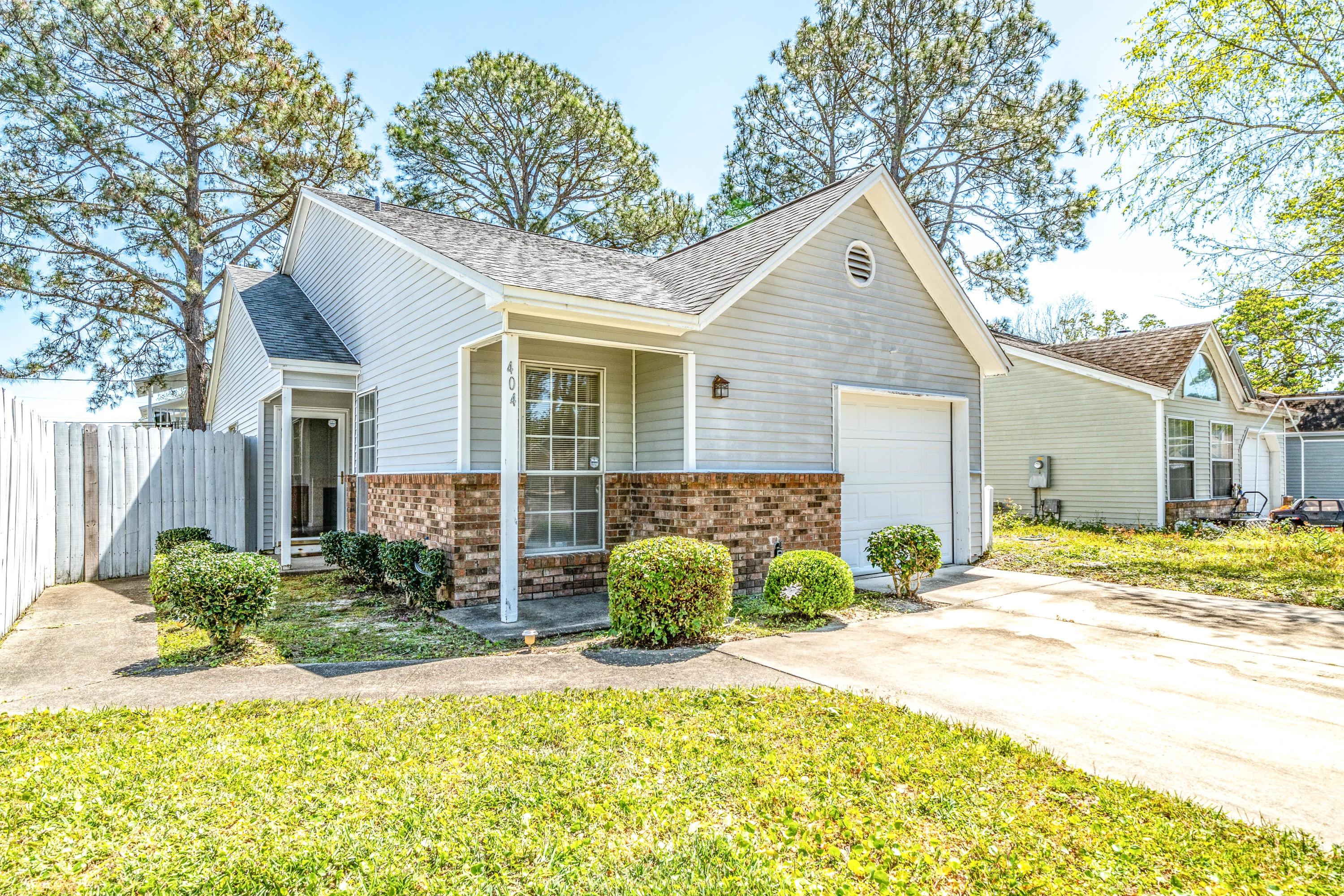 Looking for a great home ust minutes from Eglin AFB, Hurlburt AFB, NWFSC, and within a 15 minute drive to the gorgeous Emerald Coast? This house has you covered! This 2 bedroom 2 bathroom home features an open, split floorplan that is perfect for entertaining. It also features vaulted ceilings in the main living areas and a gorgeous fireplace that catches your eye as you walk in. Outside you will find a fully fenced, private backyard with a patio perfect to relax on after a long day. This home also features an attached single car garage making loading and unloading in the rain a breeze. Schedule your tour today!