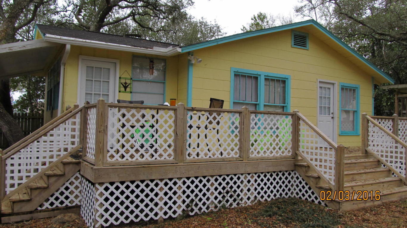 This is a ''tiny house'' that has a lot of character. It was recently renovated with a new dishwasher and kitchen appliances. The interior is finished in pine paneling with pine flooring. It does not have a bath tub, but has a nice bathroom which has been recently renovated. It has gas heat, but electric stove and hot water heater. It comes with a refrigerator but is otherwise unfurnished. It has a W/D hookup inside the house. Small dogs under 25 pounds accepted.