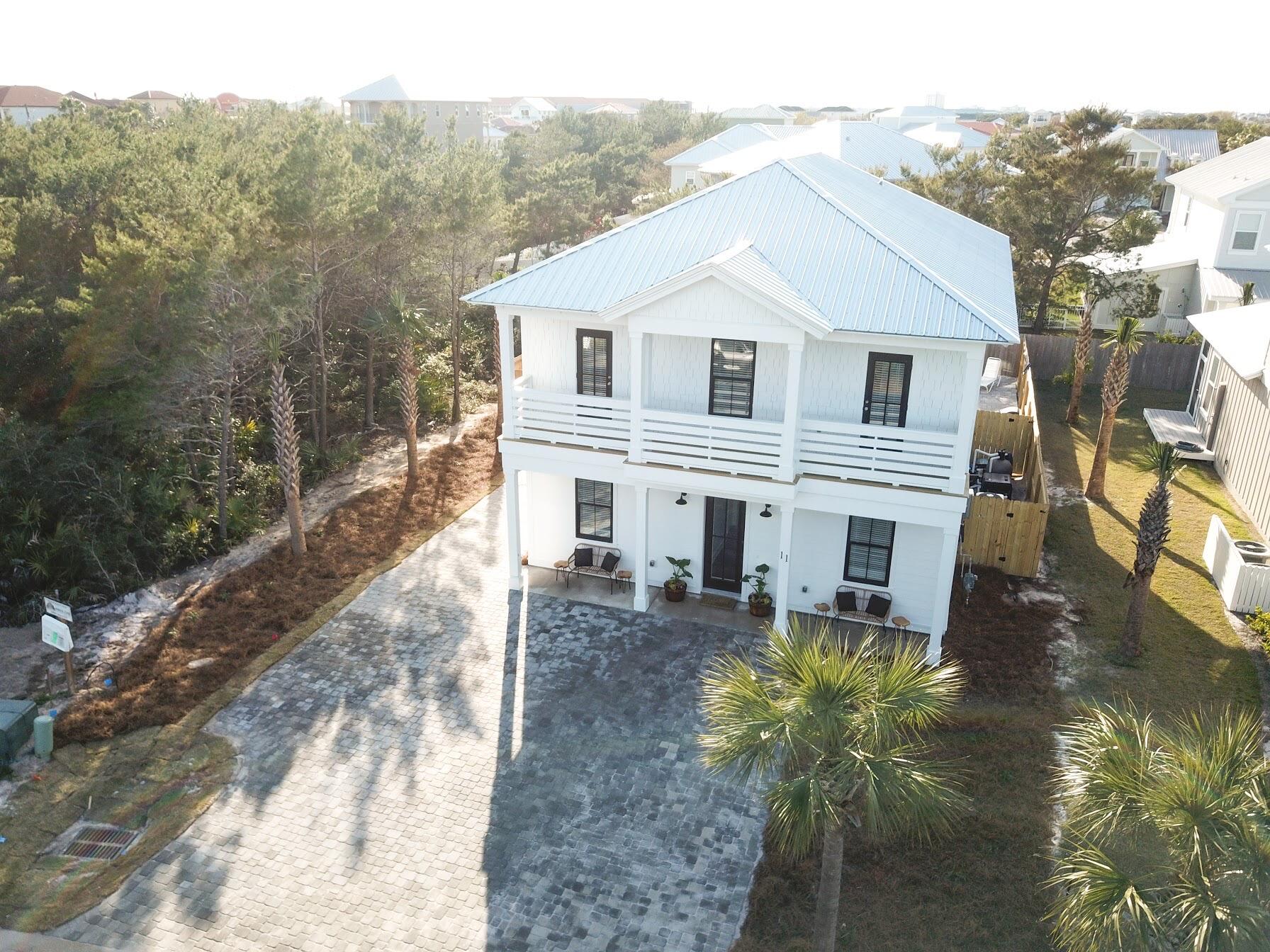 Nestled in the beautiful community of Frangista Beach with private deeded beach access, this brand new home is sold fully furnished with master on main. A rental machine that's already boasting $180,699 as the gross income total on the books for 2021. And $129,868.15 as the base rental rate total on the books for 2021, & can comfortably sleep 20 people! This spacious 2-story, 6-bedroom, 6.5-bathroom vacation home features a private heated pool for your enjoyment. On the first floor, the kitchen features stainless steel appliances, quartz countertops and opens up to the dining room seating 14 guests. The living room has a large flat-screen TV and a couch sectional with additional seating making it the perfect spot for relaxing with family! On the first floor, you will find a king master bedroom with a flatscreen TV and private bathroom including a shower. The second bedroom on the first floor features another king bed with a flatscreen TV and private bathroom including a shower/tub combo. The first floor also offers a laundry room closet for your convenience, as well as a half bath for ease of use from the living room and kitchen.
The second floor features 3 master king bedrooms equipped with flat-screen TVs and private bathrooms including shower/tub combos. The 4th bedroom on the second floor is a bunk bedroom that has two full over full built-in bunk beds and a flat-screen TV.