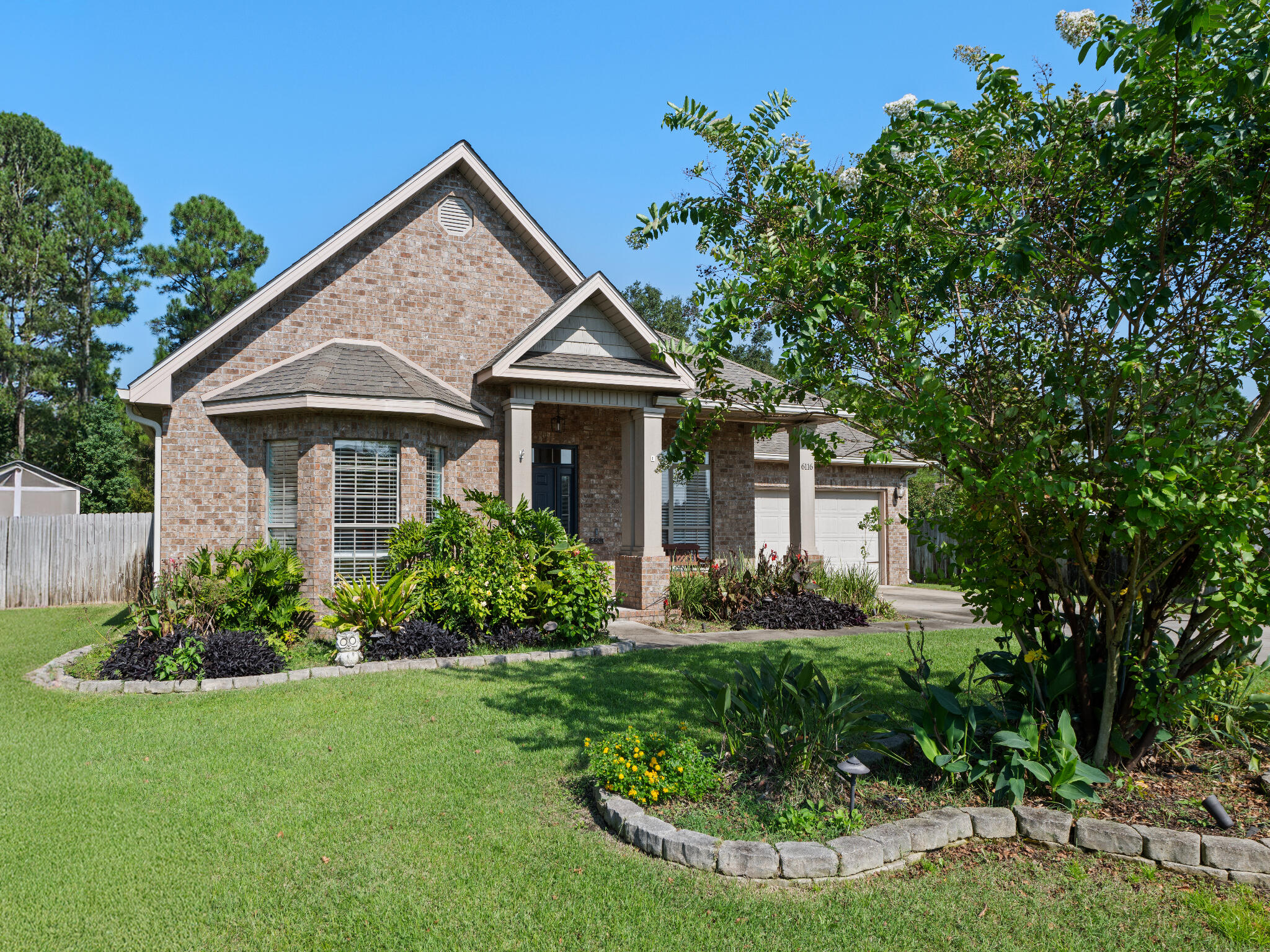 Welcome to this beautiful split floor plan, 5 bedroom, 3 full bathroom home in Summerset Estates! Situated on over half an acre and extending beyond the fence line in the back, it's one of the largest lots in the neighborhood. Excellent curb appeal with thoughtful landscaping that continues into the large, fully fenced in backyard. The large sweeping driveway leads to a 2 car garage with hallway entry. Featuring a chef's kitchen with walk in pantry, stainless steel appliances, granite countertops, island, and a breakfast bar. The living room has a built in wall length bar with granite countertop and an electric fireplace. Just off the great room, with its own wing, is the primary bedroom with large ensuite featuring a double vanity, walk in shower, garden tub, and a large walk in closet. The 4 additional bedrooms are evenly split across the home, with 2 bedrooms and a bathroom towards the north side, and the other 2 bedrooms and bathroom on the south side by the kitchen and breakfast nook. This Gulf Breeze home is centrally located between the beaches of Navarre and Pensacola, and the local military bases! With easy access to Destin, Fort Walton, Navarre, Gulf Breeze, Pensacola, and Milton!