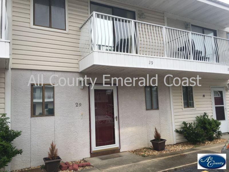 Beautiful townhouse newly remodeled in the heart of Destin. Close to schools and shopping. This 2 bed, 2 bath home features tile floor through out the downstairs and beautiful laminate wood floor throughout the upstairs. Gorgeous tile shower and updated bathroom. Fenced in yard with a nice new deck. Community pool is also available with this unit. Call and schedule a showing today!