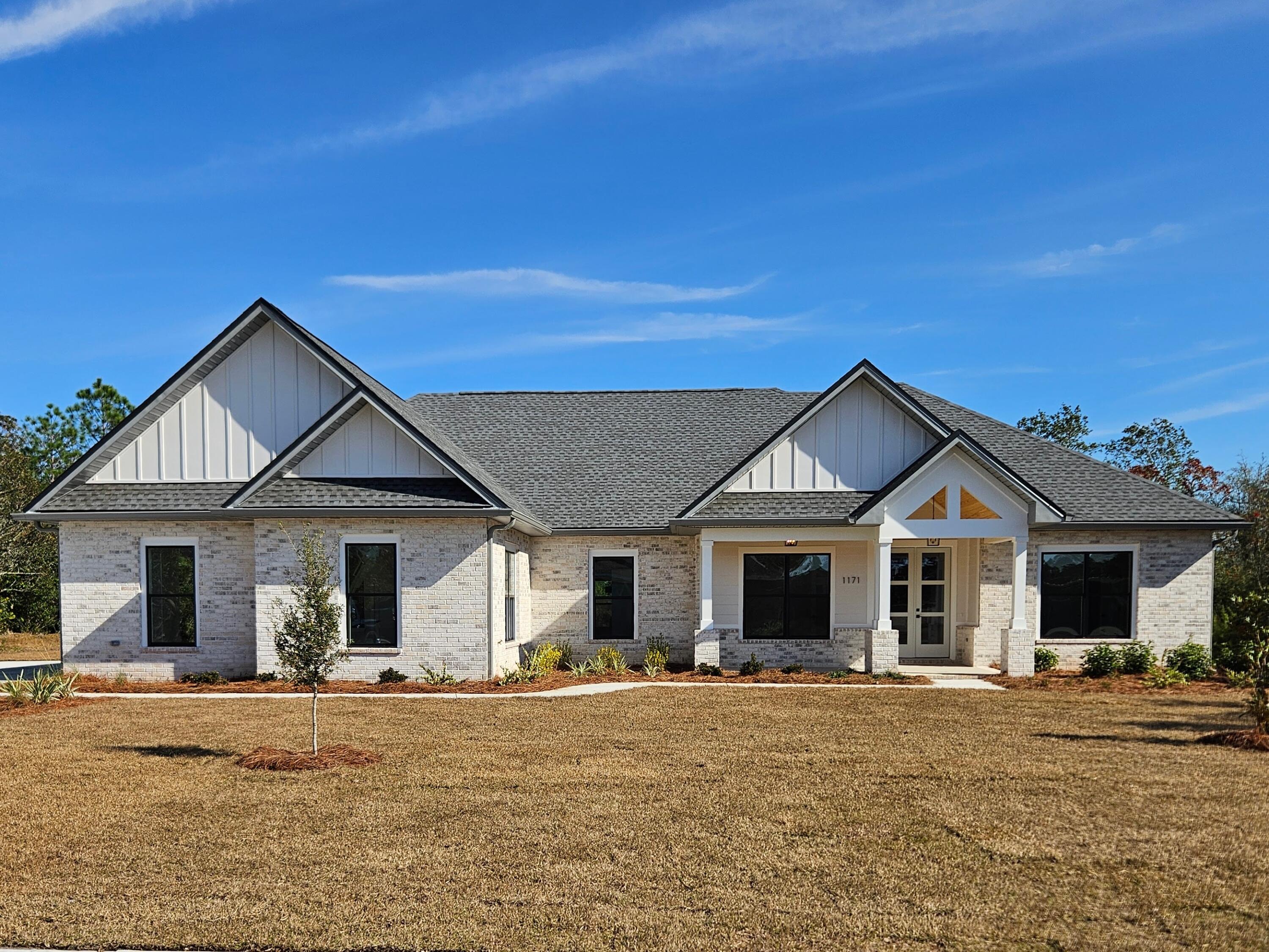 New Construction built by SHAW Custom Homes  .68 - acre lot that backs directly to the golf course. The entire property is fully landscaped with a 8-zone irrigation system. Step inside through the  8' tall double French front doors and be greeted by sophisticated, high-end finishes at every turn. The open-concept design features smooth drywall finishes, no carpet anywhere, and premium 9'' wide-plank LVP WPC flooring throughout - a durable Wood Plastic Composite core that's waterproof, quiet underfoot, and beautifully mimics natural wood. Gourmet Chef's Kitchen Designed for both everyday living and entertaining, the chef-inspired kitchen boasts: 
*Custom wood soft-close cabinetry 
*Elegant Quartz countertops 
*Striking custom vent hood with shiplap ceiling detail
*GE Profile stainless appliances
*Delta brushed gold hardware and fixtures
*Modern black-and-gold lighting and accents

Adjacent is an incredible walk-in pantry with built-in shelving, additional quartz counters, workspace cabinetry, and dedicated space for a beverage fridge - perfect for the home chef or entertainer.

Spa-Like Primary Suite & Bath Retreat to the luxurious primary bedroom featuring a spa-worthy ensuite bath:
*Oversized curb less walk-in shower with Delta rain showerhead + handheld
*Advanced Schluter waterproofing system for superior leak and mold prevention
*Split vanities with quartz tops, ample storage cabinets, and brushed gold Delta faucets
*Contemporary black-and-gold fixtures carried throughout

Thoughtful High-End Details Everywhere
*Kwikset modern door hardware in black (Lifetime Warranty)
*Delta faucets in brushed gold/bronze throughout
*Energy-efficient black double-pane windows
*2x6 exterior wall construction for better insulation and strength
*Hybrid Water Heater Wi-Fi with energy savings 
*360 sq ft storage above garage

Outdoor Living Perfected
*Welcoming front porch with tongue-and-groove wood ceiling
*Expansive back porch with vaulted ceiling and ceiling fan
*Side-entry 3 car oversized garage - Room for large-size trucks, boats, or workshop space
*Extra-large driveway for ample parking
*6' gutters on entire house

Neighborhood features: Pool, pickleball courts, basketball, playground, picnic area, tennis courts, walking trails, club house, weekly food trucks.  HOA $111 monthly , Homeowners Insurance as low as $1,232 yearly
