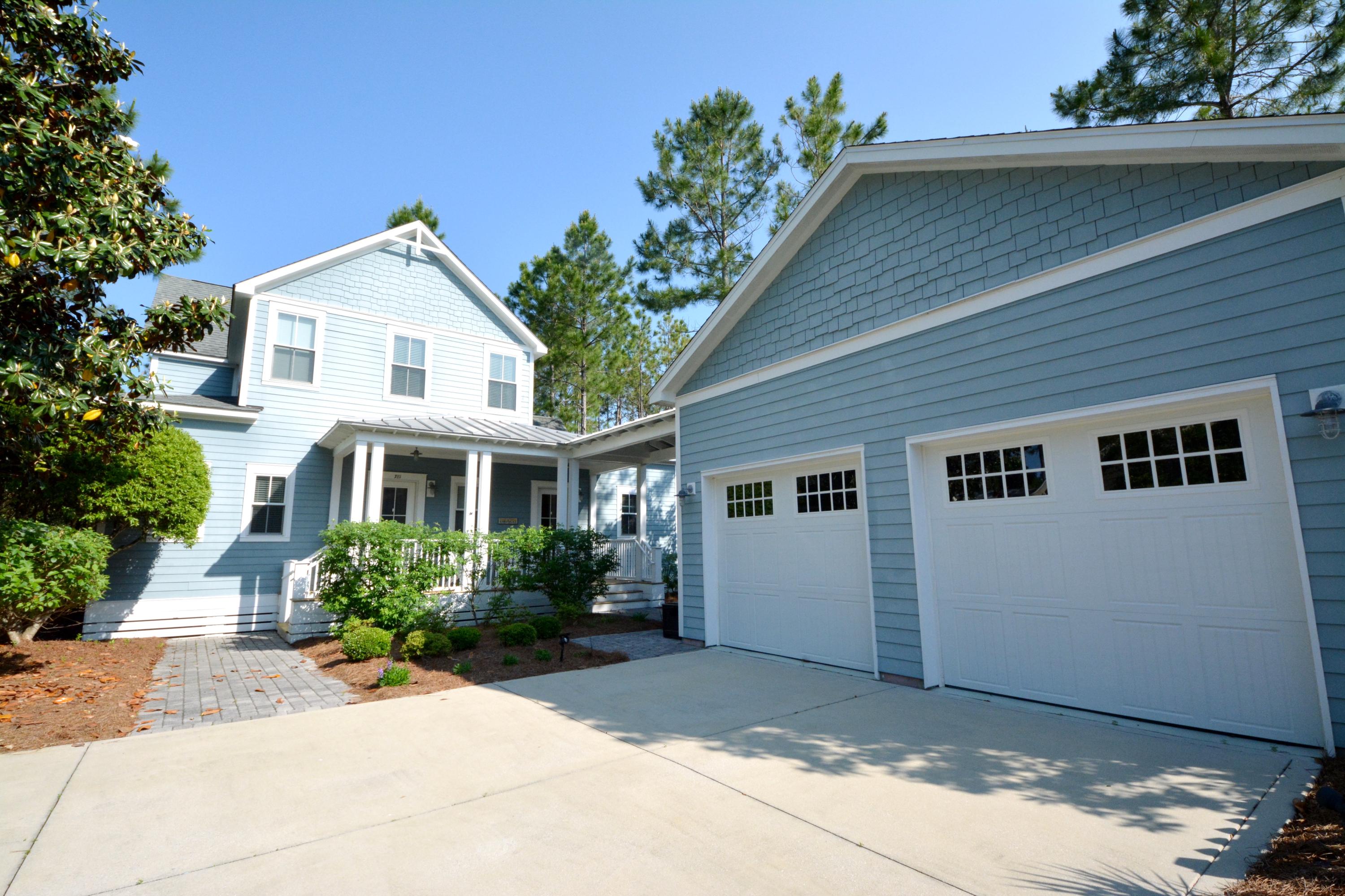 Need a lot of space? Here is your opportunity to be in Watersound Origins. This 4 bedroom, 3 1/2 bath home boasts a kitchen open to the dining area and great room, office, master with ensuite bath, large laundry room featuring a sink, counter and cabinet space, and a large under stairwell storage area. The chef's kitchen features granite, a four gas burner stove with griddle and warming drawer, GE stainless steel appliances, loads of cabinets with soft close drawers and under cabinet lights. Finishing out the first level is a screened porch that takes you to your fenced back yard. The second level features 3 bedrooms and two full baths. The home has hardwood floors throughout. There is an outdoor shower on the side of the garage for rinsing off after a day on the beach or at the pool. Renter to verify square footage and all room dimensions if important to them. Neighborhood offers golf, fitness center, 5 miles of bike trails, dock access to Lake Powell, pool, parks and our own cafe and gathering house. Active HOA and Neighborhood events - and is 5 minutes to the beach!