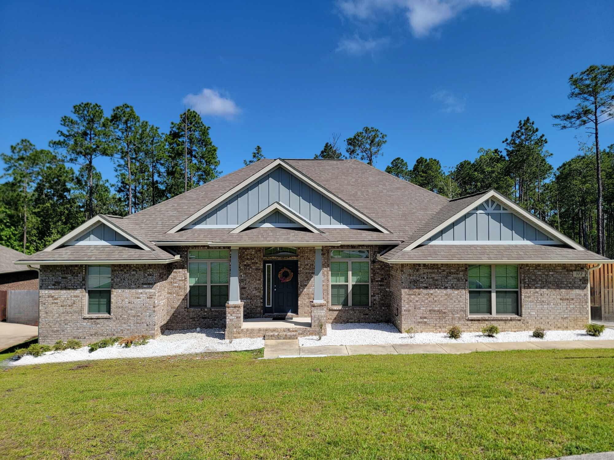 This stunning 4-bedroom, 3-bathroom residence offers 2,414 square feet of spacious, modern living. Step inside to find an open and airy floor plan, featuring high ceilings and abundant natural light. The living room serves as the heart of the home, with a cozy fireplace perfect for relaxing evenings. The kitchen comes equipped with stainless steel appliances, granite countertops, and ample cabinetry. Whether you're preparing a quick breakfast or hosting a dinner party, this kitchen is sure to impress. The home boasts four generously sized bedrooms. The master suite is a true retreat, complete with a walk-in closet and a luxurious en-suite bathroom. The master bath features a double vanity, soaking tub, and separate tiled shower.