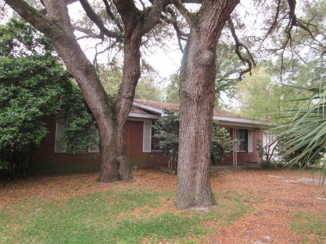 With some love, this 3 bedroom, 2 bath REO home in Fort Walton Beach could be an excellent rental investment or residence. The brick home sits on a corner lot and has mature hard wood trees. The location is convenient to shopping, schools, Military Bases and employment opportunities.