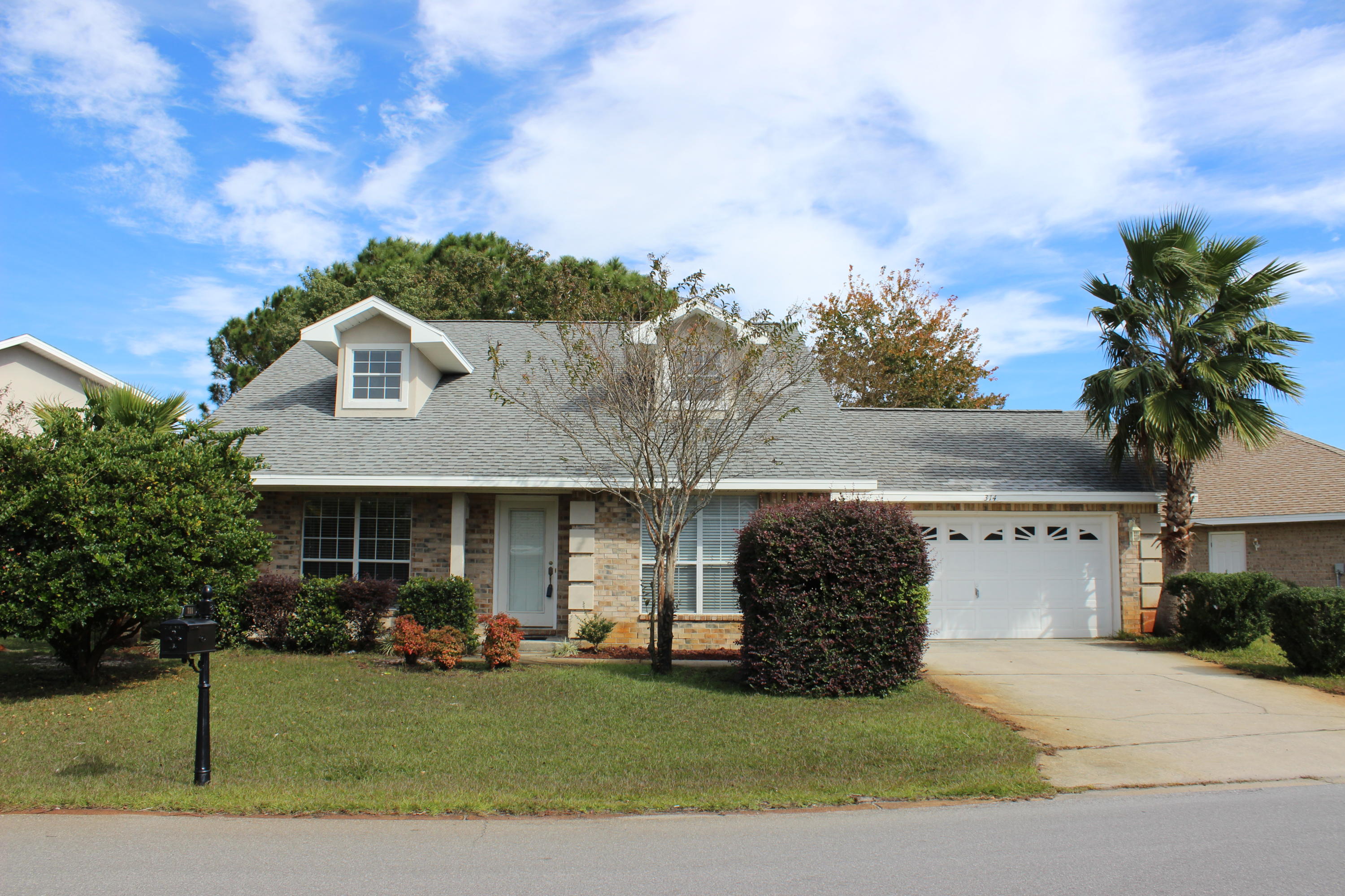 Fantastic, gated neighborhood in Destin minutes to shopping, restaurants and beautiful beaches. Just updated with LVP, new carpet, lighting, fans, mirrors and interior paint. Kitchen and bath cabinets painted and new hardware. New roof June, 2019. Nicely landscaped yard backs to a preserve for maximum privacy. Emerald Lakes offers community pool, tennis, park. picnic area, lakes with walking paths and more. Priced at the low end of neighborhood, it's a great family home or investment with short term rentals allowed. Pretty curb appeal with dormers, covered entry porch and brick exterior with stucco accents. Living room has vaulted ceiling and pretty fireplace. Large master suite on 2nd floor with 10x7 walk-in closet. Ready for immediate occupancy. Don't miss this opportunity!