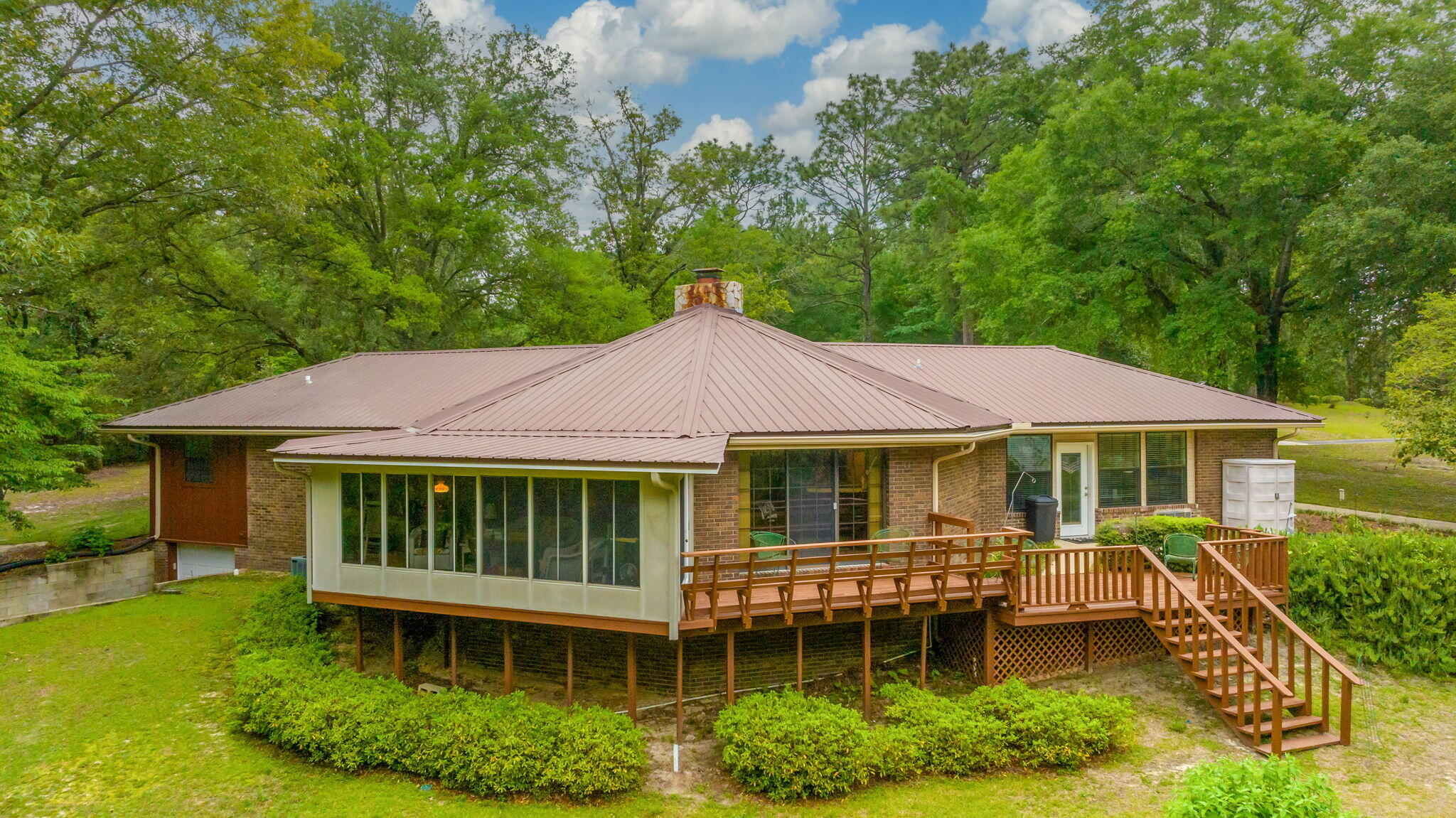 RARE 251 ACRE FLORIDA HOMESTEAD -  One owner SPORTSMAN'S PARADISE featuring RIVER FRONTAGE (SHOAL RIVER) and a VARIETAL BOUNTY of HUNTABLE WILDLIFE ON PROPERTY. Main home approx 2195 SF heat&cooled (+basement +covered drive thru parking +entertainment decks). Two substantial accessory buildings include 40x60 barn and separate workshop (both w/power & water). Please view all professional photos which also include multiple aerials of the acreage. Located just outside Crestview, so convenience is an appealing factor as well. There are many established hunting and nature trails. Current homesite was selected for its huge oak shade trees and improved with beautiful mature landscaping. Many family memories to be made in this home, designed for entertaining and functional living space. MAKE APPT!