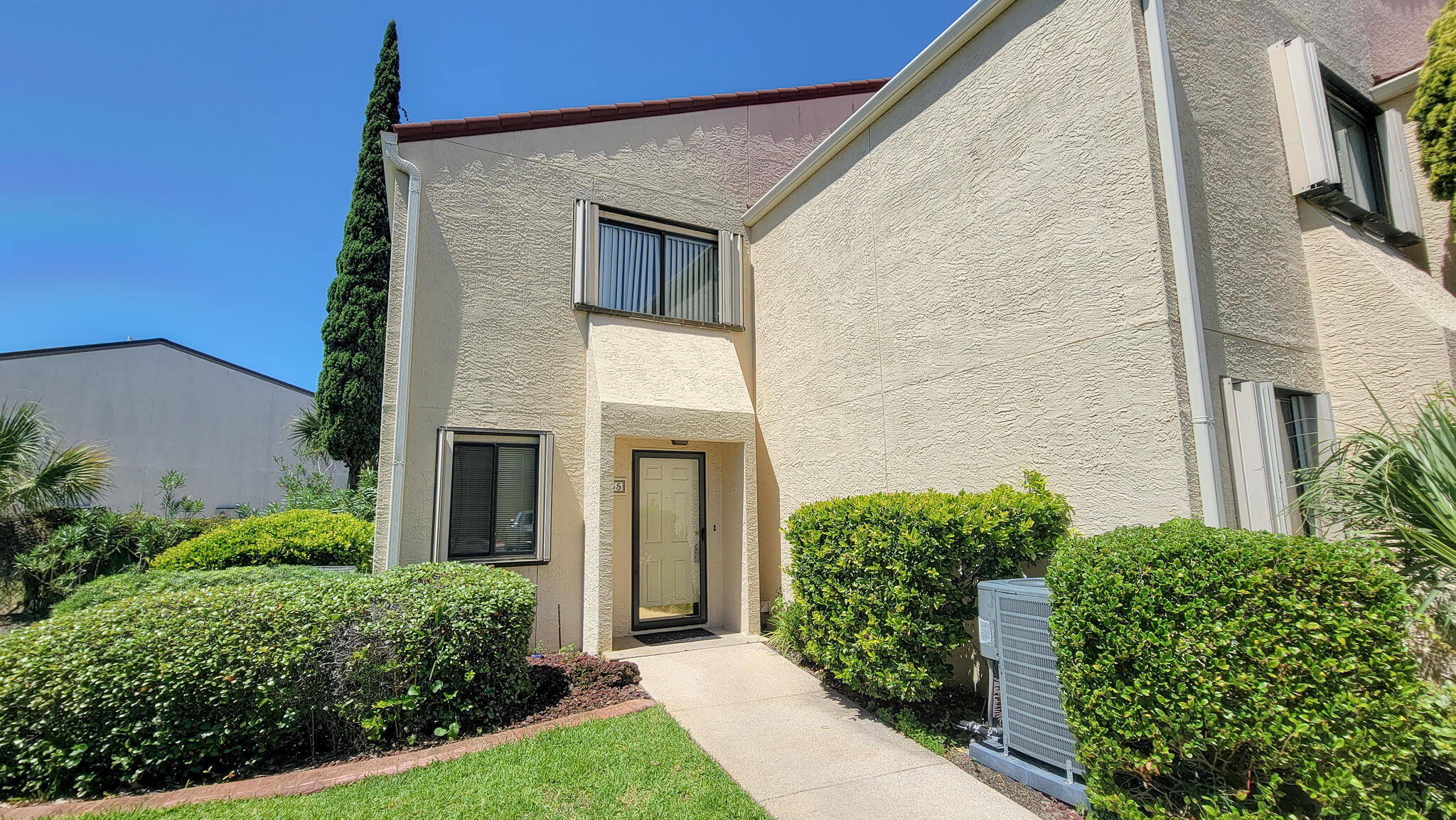NEW PRICE reflects updates unit needs! WATERFRONT LIVING in this quiet & private END UNIT townhome on Okaloosa Island! Low HOA dues only $231/month which covers, large pool, gated community, marina with boat slips for rent, walkover to beach & gazebo. Open concept floor plan as you enter w/tile through-out on 1st floor. Enjoy summer nights on your covered patio!  Also on 1st floor is storage closet under the stairs, half bathroom & large laundry room with storage. Upstairs are two spacious master suites, both with private full bathrooms. The main master bedroom has its own balcony. Pull down attic for additional storage. Roof is made of extremely durable stone coated steel tile.  Brand new HVAC condenser 2022. Water Heater 2015. Hurricane shutters throughout allowing an insurance discount. NO SHORT TERM RENTALS ALLOWED at Clipper Cove. Unit is just 200ft from the Gulf in a gated community, marina with power/water, beach walkover, covered gazebo area on the water great for fishing or watching the dolphins play, and a large gated community pool with sundeck + bathrooms.  Parking space #35 comes with the unit.