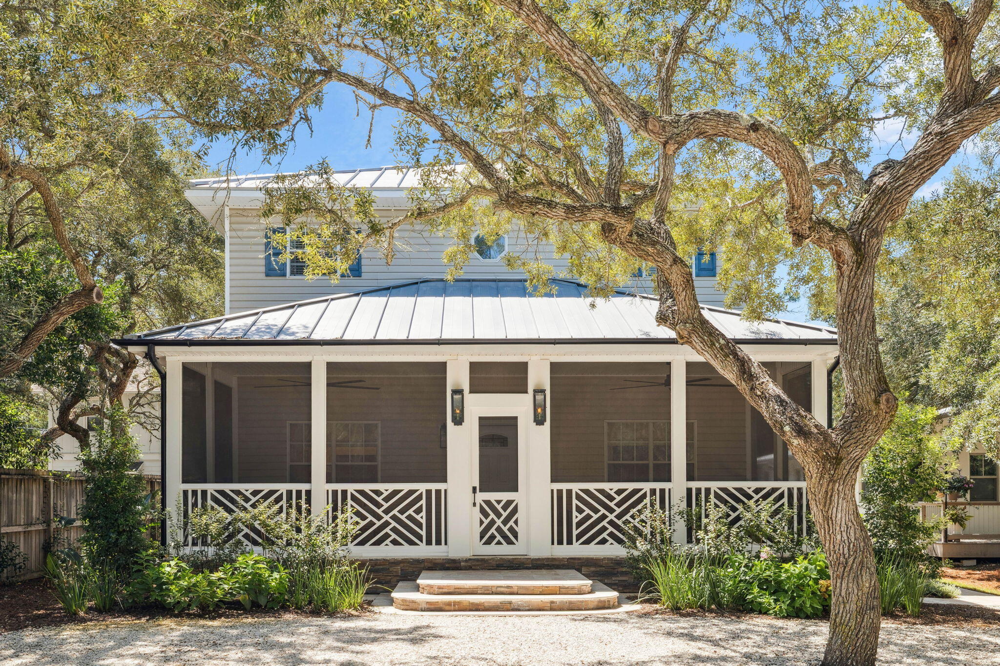 Aptly named 'Happy Thoughts' and located on the quiet end of one of the most desirable streets in historic Grayton Beach, this freshly-renovated home truly has it all. Built in 2004, with a full-home renovation in 2023, this home boasts 5 bedrooms, 5.5 bathrooms, 2,873 square feet of heated and cooled living space, and is sold fully furnished with minor exclusions. As you enter the home you are greeted by a thoughtfully designed kitchen, living, and dining area that feels effortlessly cozy. 10 foot ceilings and an abundance of natural light add to the home's appeal. The living area is accented by a white brick wall with a built-in gas fireplace. The kitchen is outfitted with top-of-the-line appliances, a generous 8'x6' island, a large farmhouse sink, custom cabinetry, an under-counter ice maker, and a dramatic oversized range hood.
The first floor includes a nice-sized laundry room, with a sink and additional full-sized refrigerator; an elegant half bathroom; and the primary bedroom suite.

The first-floor primary bedroom exudes elegance with its king-sized bed, attached home-office, and luxurious ensuite bath featuring a double vanity, a soaking tub, and a glass-walled shower. Heading upstairs reveals 4 well-appointed guest suites, each with tasteful en-suite bathrooms. The custom queen-over-queen bunk room is the perfect spot for the kids to sleep comfortably.

Now let's talk about the back yard! The generously-sized fenced backyard highlights a custom outdoor pavilion with vaulted ceilings and a large dining table, a gas grill, a brick-paved fire pit, and a storage unit for beach equipment and bikes. Additional ample covered storage can be found just inside the screened-in back porch entrance. The property backs up to an alleyway, allowing an alternative ingress/egress to the yard - a rare feature in Grayton Beach. And if a pool is desired, there is plenty of room to build one. 

Come take a look and see what the best of Grayton has to offer.