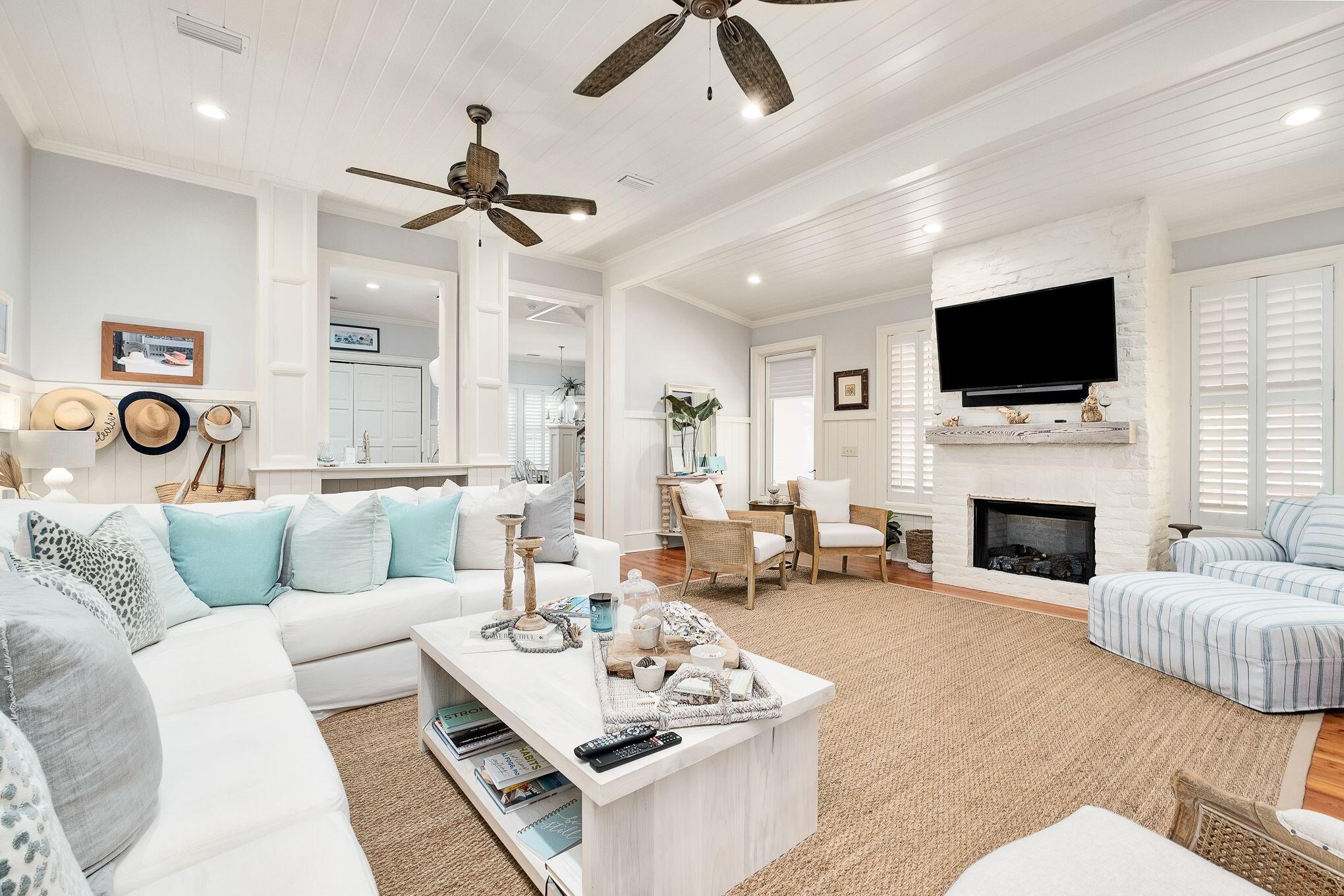 Phase 1 Watercolor,  4 Bedroom, 4 1/2 bath property with a gorgeous wrap around porch overlooking Crimson Park in Watercolor!  You will feel the beachy vibes radiating from the property the moment you pull in! This home has just been renovated and newly furnished and is gorgeous!  The home offers plantation shutters throughout and has lots of natural light making it warm and bright and has all of the beach feels. The dining area is adorned with shiplap walls and crown molding and is an inviting area to enjoy dinner with family and friends. The kitchen offers marble counter tops and a large breakfast bar, beautiful white cabinetry, stainless steel gas range and microwave oven, deep single basin sink and cabinet fronted dishwasher and refrigerator, beachy blue subway tile backsplash and a window cut out into the large living area that has a little office nook, a stately white brick fireplace, white shiplap walls and ceiling and double doors that open to the wrap around porch! The first floor also has the highly sought after master bedroom which offers a spacious seating area, white shiplap and beamed ceiling, walk in closet and an ensuite master bath also with shiplap walls and crown molding,  gorgeous tile flooring with a soaking tub with a beautiful chandelier above, stand alone shower with tile accent, dual vanities and water closet.  The master bedroom also has double doors opening to the wrap around porch. A laundry area and half bath complete the first floor.  The second floor offers a lovely sitting area with white shiplap walls and crown molding with a wet bar accented with tile backsplash and 3 additional guest bedrooms, each with their own ensuite.  With the exception of one bedroom upstairs the home offers hardwood floors throughout.  The home has an exterior storage area, carport, paver driveway, outdoor shower and a large wrap around porch appointed with new exterior furniture to include a porch swing and several sitting areas. This home is in the front of Watercolor and very close to the Watercolor Town Center and the Watercolor Beach Club. The WaterColor community includes residential homes and an award-winning beach side resort located on the beautiful Gulf of Mexico beaches and alongside serene Western Lake. The community is designed to have a small-town feel and is perfect for exploring on foot or by bike. Quaint streets and pathways connect homes to the community's parks, lush green spaces and shops.
Residents have access to a state-of-the-art tennis center, including a stadium court surrounded by a grass-stepped terrace and native landscaping, five Har-Tru HydroCourt clay tennis courts and a pro shop with tennis gear. Private lessons, group clinics and other activities are available throughout the year. The community includes access to a boathouse with paddle boards, kayaks and fishing equipment; an outdoor amphitheater; a lakeside pool; a bike barn and more. As one of the larger neighborhoods along 30A, WaterColor has amazing amenities for the entire family to enjoy including  9 community pools. There are 3 pools at the Beach Club, 3 pools at Camp WaterColor (one is a lazy river!) plus the famous Frog Pool, Dragonfly pool and Boat house pool. Call today to schedule a showing to see this Watercolor Beach House!