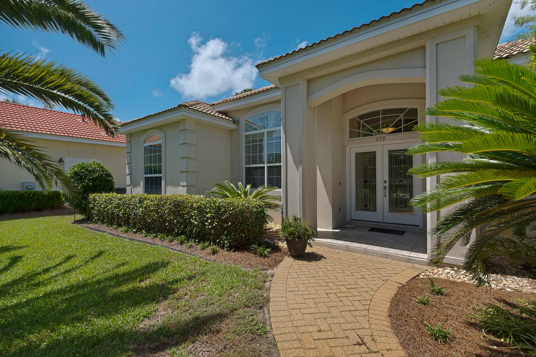 Excellent in every way in beautiful, gated Emerald Bay! Being sold as is!
(Click on the photos and virtual tour) to discover the lush tropical landscaping, attractive leaded glass entry doors, awesome open floor plan, crown moulded ceilings, great golf course location, and many custom features that make this home the one to own in the heart of all in the Destin/Miramar Beach area! This is a fine home to entertain in both inside and out with a large screened in lanai leading out to peaceful views of trees, water & the nicely manicured 5th hole putting green. Relax and be comfortable enjoying the wonderful amenities (Premier Golf Course, Tennis Courts, Clubhouse, Guesthouse, Community Pool) along with the friendly staff of Emerald Bay. One of the last private lots!!!!