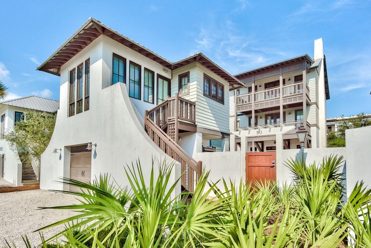 This is Costa Carina at its finest!  Bordering the Rosemary Beach tennis courts, you'll feel like part of Rosemary but without any HOA fees!  Step through the gate into the private courtyard covered in natural stone.  The large pool and numerous poolside gathering areas will be a favorite among guests or renters.  A set of French doors carry you into the first floor living space with professionally designed interiors, Thermador appliances, dining off screened porch, and elevator.  The gas fireplace lends a striking compliment to the tall windows and abundance of natural light.  Through a second set of French doors you're greeted with more outdoor living.  Lush green Japanese Yew frames three sides and offers you a choice of gathering under the bistro lights or lounge in the fully screened porch. The second and third levels host 4 bedrooms, 3 with ensuite baths, a bunk area, wet bar, laundry and 2 outdoor porches.  The Carriage House is nestled above a single car garage.  The private quarters are well appointed with a living room, kitchenette, bedroom and separate bath.  This stunning residence is a second home and never rented except for the Carriage House as of recent.  Stroll through Rosemary Beach to the quaint shops & restaurants or over to 30Avenue and Inlet Beach entertainment.