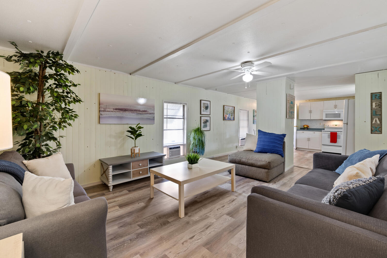 One of our new west-end favorites! This mobile home is absolutely adorable & is furnished with beach decor. Excellent open floor plan with a split bedroom layout. This home has upgraded flooring & paint and new windows units. Bonus room is perfect for custom bunks, office, or additional storage. The large covered porch is ideal for extra entertaining space. This charmer sits on an oversized lot (65x125), including a shed & fenced-in yard. It is excellent and bright and move-in/rental ready! There is plenty of room for your beach toy, boats, golf cart, and guests. This would make a fun rental property or your very own beach getaway. Brilliant location! Beach access is fantastic! Pier Park, the 30A corridor & Carillon.