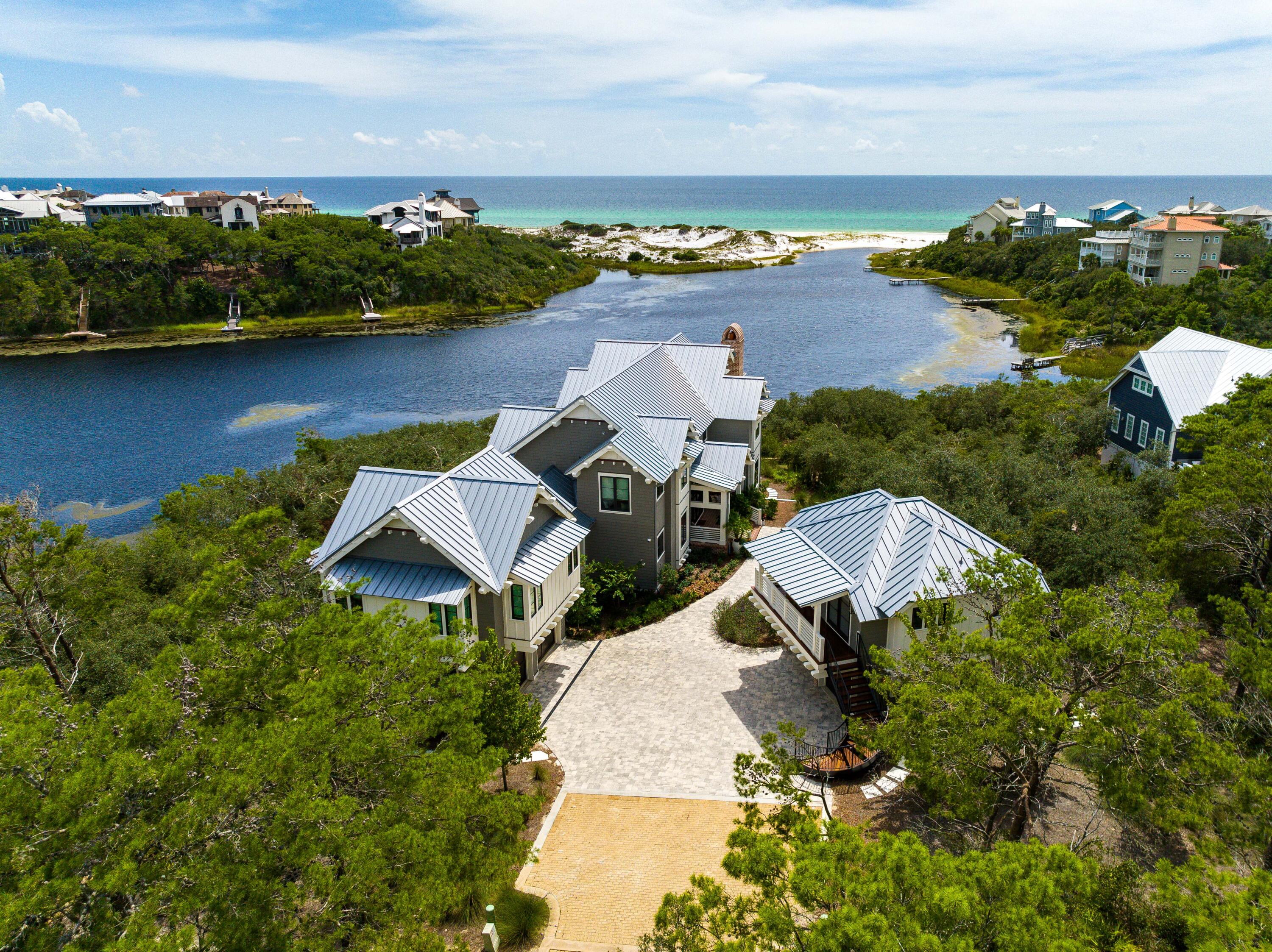 The Majestic Property sits on the Edge of Draper Lake with Expansive Views of the Gulf of Mexico

Picturesque vistas abound from this Frank Lloyd Wright inspired masterpiece featuring approximately 135 feet of private lake frontage and majestic views overlooking Draper Lake and the stunning white sand beaches & rolling dune topography of the Gulf of Mexico. This extraordinary residence artfully combines contemporary design with classic naturalist architecture indicative of the Adirondacks and juxtaposed the beautiful ever-changing backdrop of a coastal dune lake.

Positioned at the southernmost point of the gated neighborhood, 58 Sinclair Lane is perched at one of the highest elevations on 30A occupying an oversized .274 acre parcel.