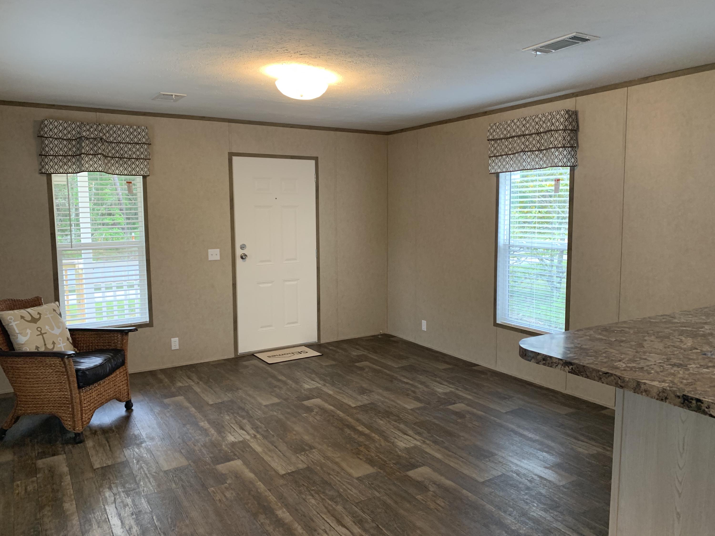 This newer Coastal Cottage 2 bedroom 2 bath open floor plan. 6 foot covered front porch. Stainless steel appliance with side by side refrigerator. Adbundant kitchen cabinets with a nice sized pantry. Private master bedroom with is own master bath. Vinyl flooring and window coverings throughout. Large lot with ample space to park a utility trailer, jet ski or boat. Low maintenance lawn. Home is unfurnished. No pets and no smoking is allowed in the home. Please apply at https://apply.link/3c6l4 www.rentspree.com