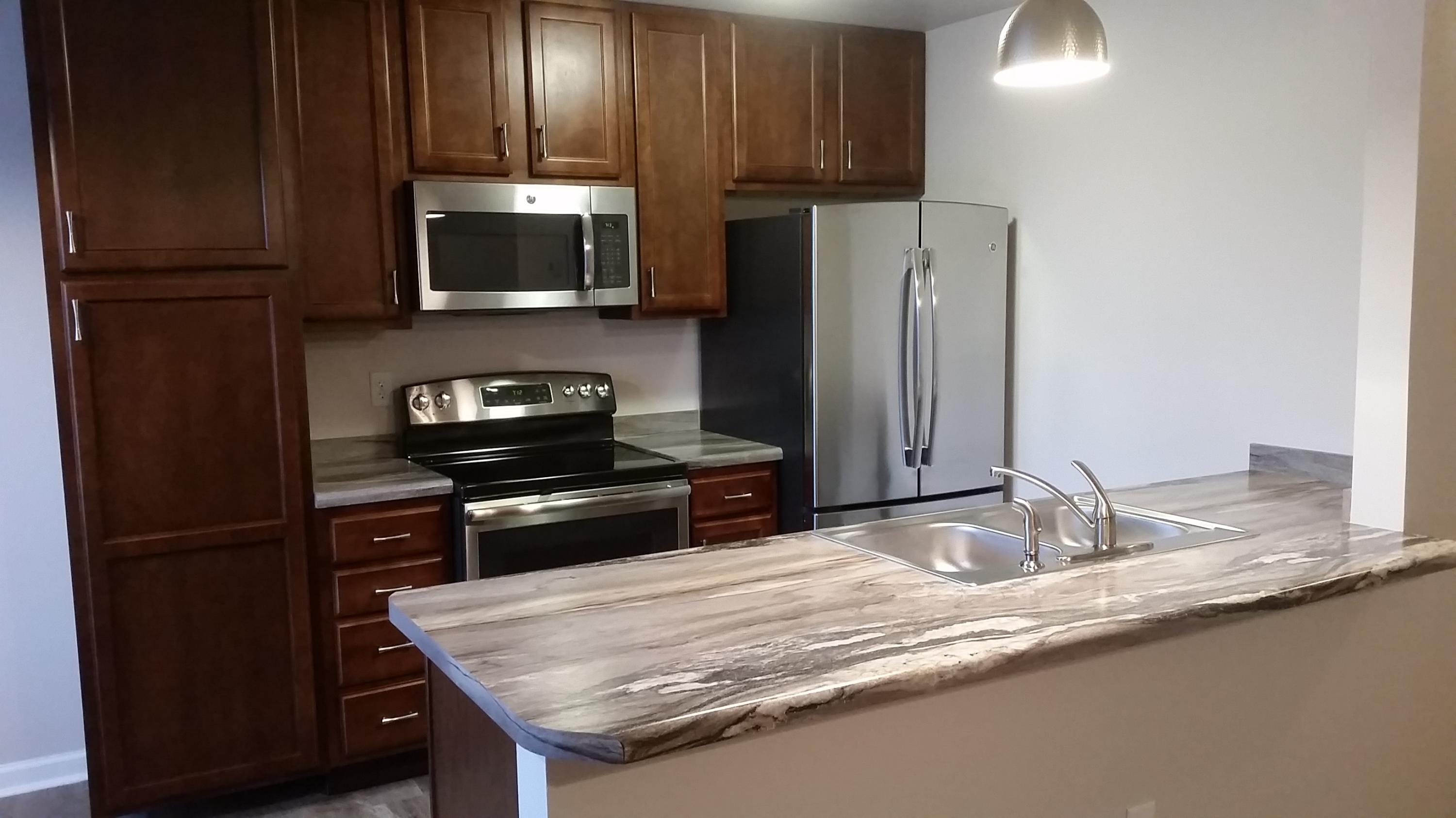 Very nice 2 bdr 1ba apartment that has been completely remodeled. The kitchen features all new stainless steel appliances, cabinets, countertops and tile flooring. The remodel opened up the floor plan to provide more living area and an open contemporary feel. There is new carpeting throughout and the bathroom has been remodeled to include new tile flooring, new vanity and sink and a custom tile surround in the bath/shower. The water heater and a/c unit are also new.