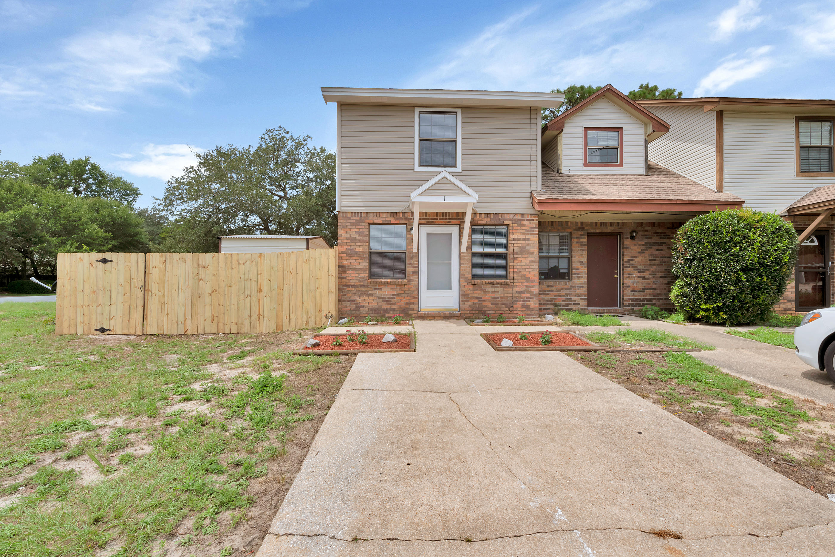 This townhome is located in the heart of Shalimar on a corner lot with a private and spacaious backyard.  The home featues new floors and paint throughout. A spacious kitchen and separate laundry room. Wall to wall carpets in the bed rooms located upstairs. The home features two bathrooms one full upstairs and a half bath located downstairs. NEW HVAC and water heater.  New flooring, New exterior vinyl siding and newly repaired privacy fence. Oversized backyard.