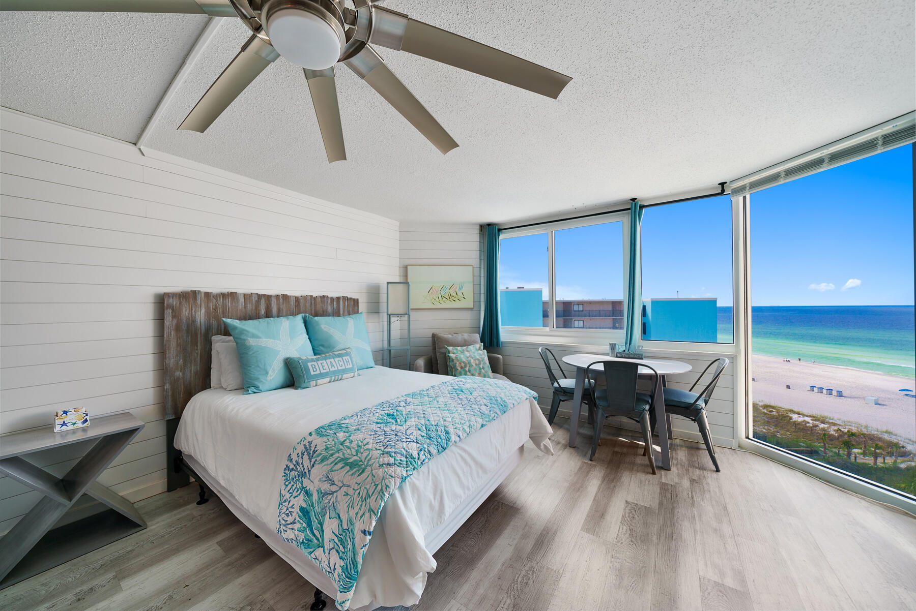 Unique opportunity to own this cozy and newly updated highly desired top floor condo with spectacular views of the Emerald Coast. This unit is offered fully furnished, featuring two new queen beds , flatscreen tv, and a dining table for four beside a floor to ceiling window overlooking the white sandy beaches. This unit is fully updated with new AC, hot water heater, and cosmetic features such as a new backsplash, appliances, countertops, wood paneling, and more. 
This building boasts newly redone elevators and recently resurfaced floors. Newly replaced exterior doors and windows, railings, and you can enjoy complex wide wifi. Grills are available for residents to BBQ and laundry services are available through the complex! The complex offers multiple balconies to enjoy panoramic views of the gulf, an awesome place to watch the waves crash and the vibrant sunsets. The well maintained and cozy complex of 200 condos and 8 stories offers private beach access. This appealing location is walkable to Pineapple Willy's beachfront restaurant, Signal Hill Golf Course, and many other restaurants and popular attractions. The complex is located in Top of the Gulf, a highly desired area, committed to excellence and community. This is an opportunity to own a cozy slice of paradise in Top of the Gulf.