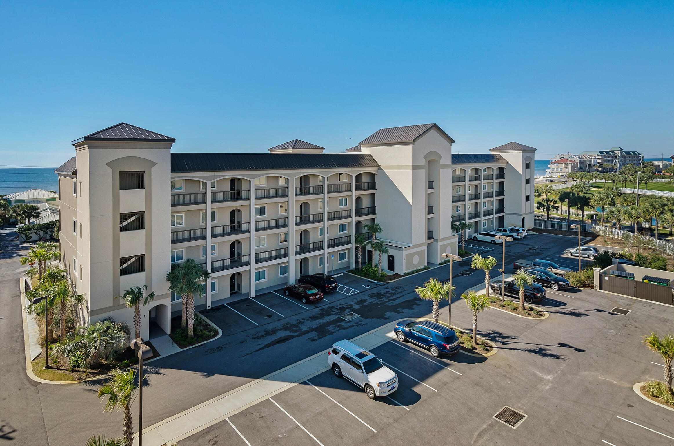 Purchase w/ 10% down. PRICED TO SELL! RESERVED PARKING SPACE! Step into elegance at your NEW privately-gated Beach Condo - Alerio E402! This stunning top-floor, 2-bedroom, 2-bath luxury condo is directly across the street from the sugar-white sands of Miramar Beach. This turnkey, fully furnished residence is a rare find and an unbeatable investment—now is the time to buy your dream beach escape or high-performing rental! Soaring 10-foot ceilings, rich wood flooring, crown molding, and granite countertops throughout give this beach condo an upscale, coastal-chic feel. The chef's kitchen is outfitted with sleek stainless steel appliances, a full-sized washer & dryer, and all the modern conveniences of home. Unwind on your private balcony with morning coffee or sunset cocktails. Read more... The king master suite boasts a spa-inspired ensuite bath with steamy- glass walk-in shower, while the second bedroom features a twin-over-full bunk, plus there's a queen sleeper sofa in the living area comfortably sleeping up to 6 guests.

Located in the gated, upscale community of Alerio, enjoy exclusive amenities including a seasonally heated pool with waterfall feature, hot tub, splash pad, grilling area, and two deeded beach access points - just steps from your door!

You're also within walking distance of Surf Hut and Cabana Café, and just a short drive to Silver Sands Premium Outlets and the vibrant Village of Baytowne Wharf for dining, fireworks, and live entertainment. 
You will also have a reserved parking spot + the complex has a separate "Owners Only" section of the parking lot.

Qualified buyers can purchase w/ only 10% down!