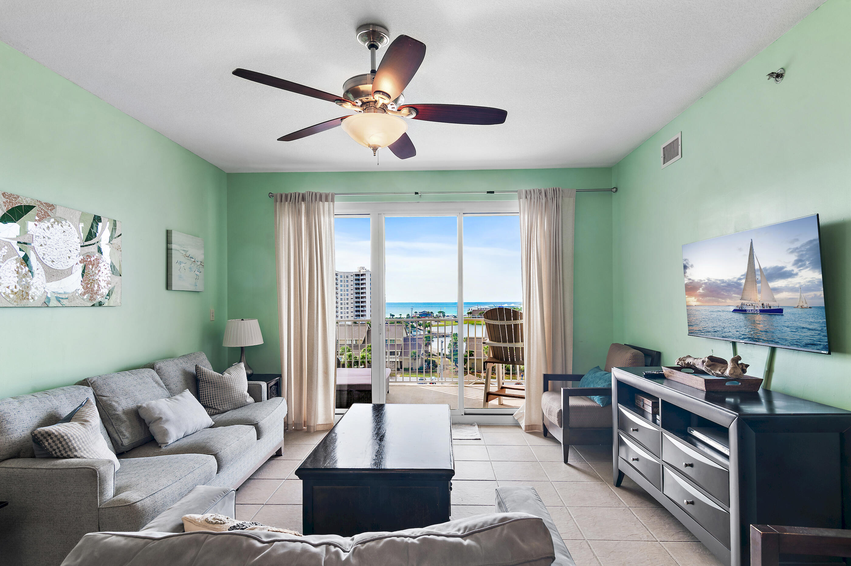 Experience elevated coastal living at 122 Seascape Blvd, Unit 608 -- a refined retreat within Ariel Dunes II at Seascape Beach Resort. This fully furnished 2-bedroom, 2-bath condo blends comfort with breathtaking views, offering the ideal escape for beach lovers. From the spacious private balcony, take in panoramic views of the Gulf, Stewart Lake and spectacular sunsets that paint the sky each evening. Inside, the open-concept layout is designed for both relaxation and entertaining, with stylish furnishings and a bright, inviting atmosphere. Ariel Dunes II provides resort style amenities, including three expansive pools, a state-of-the-art fitness center, the popular Cabana Café, and a large grilling area perfect for gatherings. Click ''more'' to continue. Owners and guests also enjoy full access to the unparalleled offerings of Seascape Resort with two additional pools, multiple tennis and pickleball courts, a golf course and deeded beach access. Whether you're seeking a primary residence, a refined second home, or a strong investment property, this condo places you at the heart of Miramar Beach's premier coastal destination.