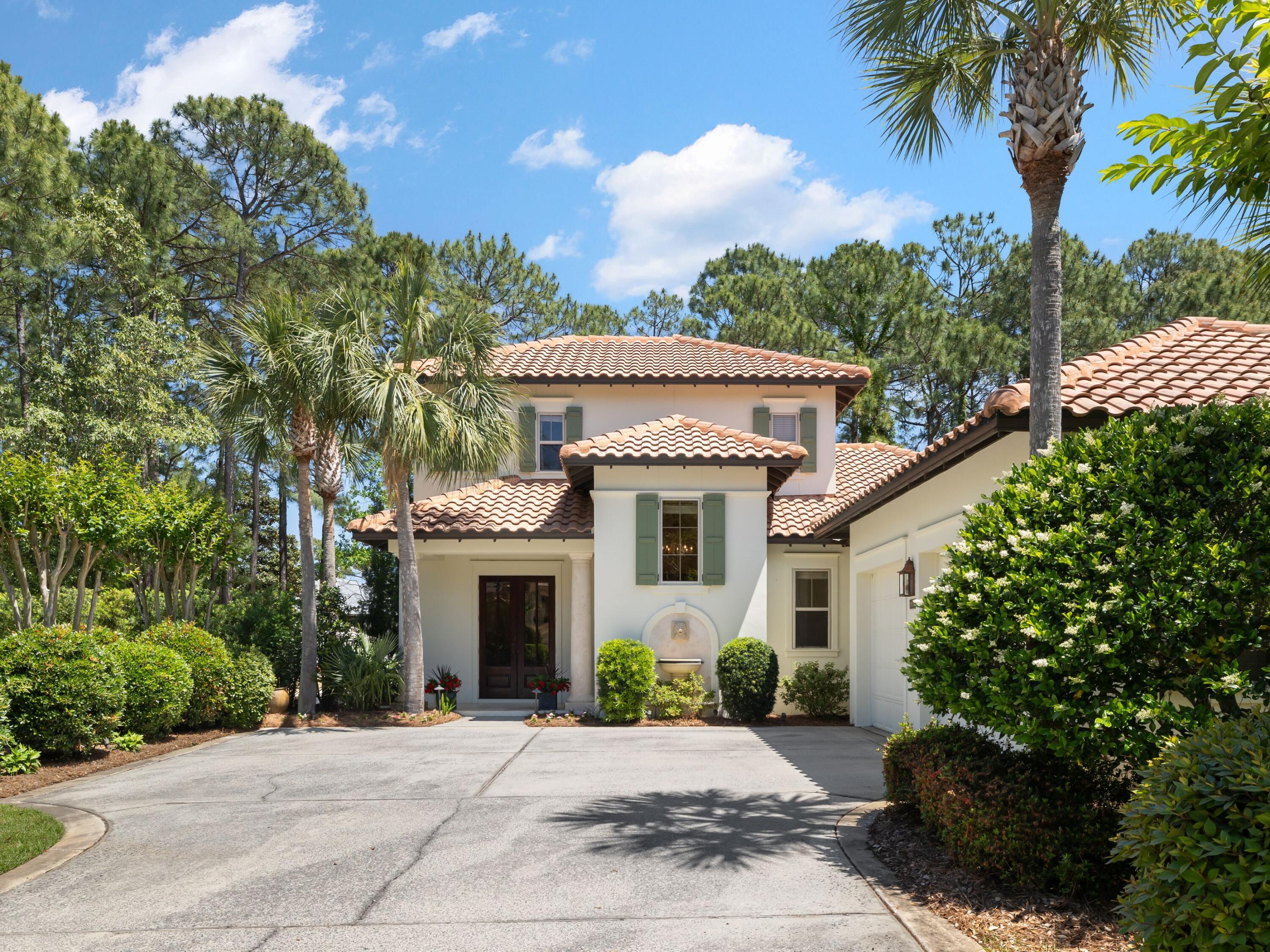 Situated on one of the largest lots in the coveted Vineyards enclave within Sandestin Golf and Beach Resort, this elegantly updated home offers the perfect balance of quiet privacy and refined resort living. Tucked at the end of a peaceful street and thoughtfully enhanced with a new pool (2022), fresh exterior paint, and new upstairs flooring (2023), the home is ready for immediate enjoyment, whether as a full-time residence or luxurious second home.

Polished travertine floors lead through the light-filled main level, where a gourmet kitchen opens to a gracious great room and dining area. The first-floor master suite includes its own sitting room and tranquil views of the screened lanai. Dual vanities, an oversized shower, and soaking tub elevate the primary bath. A second downstairs guest suite offers comfort and privacy with its own ensuite bath and walk-in closet.

Upstairs, a guest bedroom with a private bath is joined by a versatile fourth bedroom or office, complete with a built-in desk, quartz counters, beverage fridge, and wet barperfect for remote work or hosting in style. The lush side yard borders a wooded common area that cannot be developed, ensuring lasting privacy.

Residents of the Vineyards enjoy the peaceful side of Sandestin Golf & Beach Resort, with landscaping included and no short-term rentals allowed.  Yet residents still enjoy exclusive access to Sandestin's top-tier amenities, including private deeded beach access, championship golf courses, a world-class tennis center with pickleball courts, and miles of scenic trails perfect for walking or biking. Plus, shopping, dining, and entertainment await just a golf cart ride away at both the Village of Baytowne Wharf and Grand Boulevard. Whether you're lounging poolside under the palms or out exploring all the resort has to offer, this home is a serene retreat at the center of it all.
