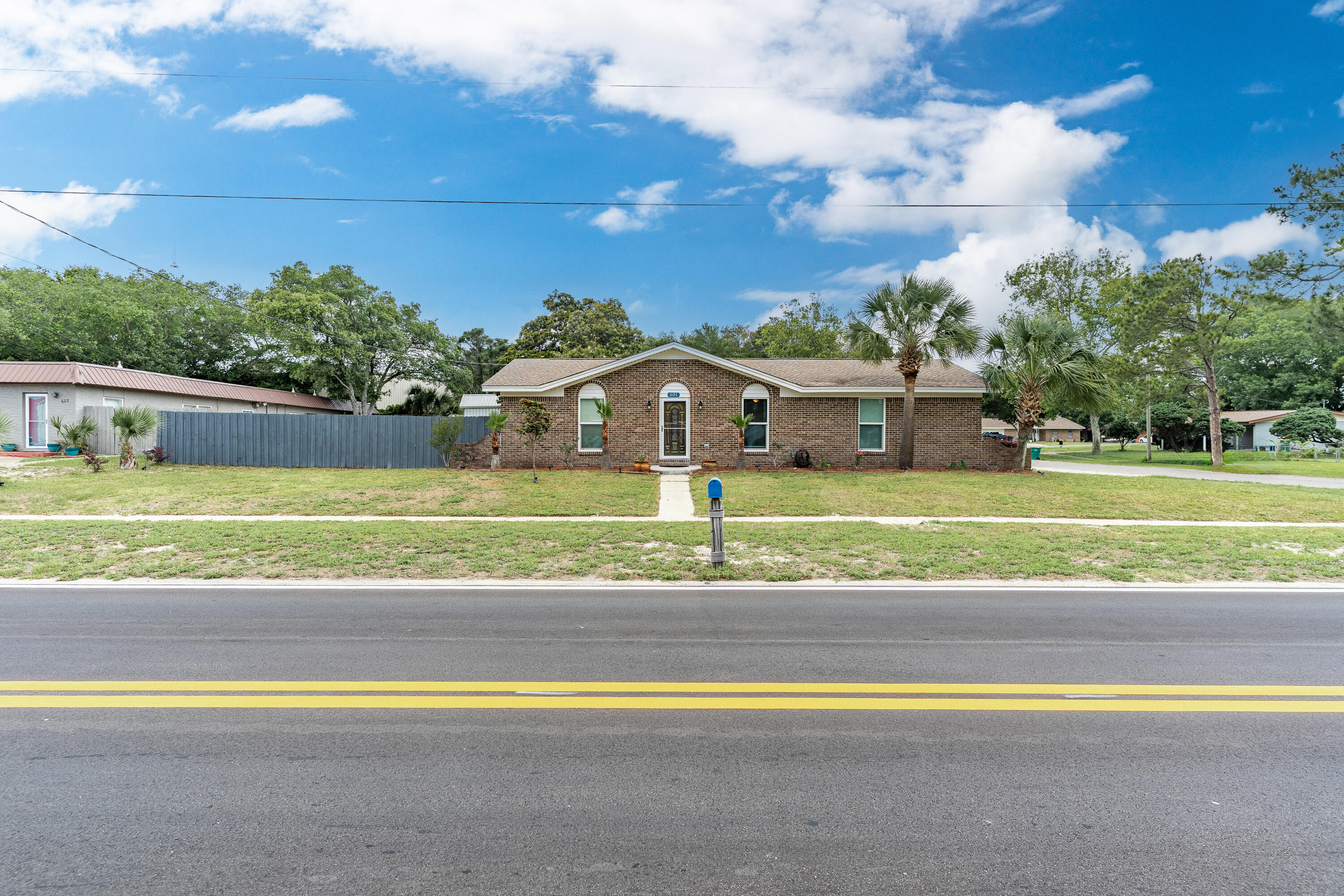 Beautifully remodeled 3-bedroom, 2-bath home with a 2-car garage, boat/RV parking, and a prime corner lot location in the heart of Destin. Completely renovated from the studs up, this home boasts brand-new electrical wiring and fixtures, fresh drywall, hurricane-rated windows, stylish new flooring, custom cabinetry, granite countertops, a chic tile backsplash, and stainless steel appliances. Both bathrooms have been fully updated, with the master suite featuring laminate flooring and an upgraded bath complete with a modern vanity and a tiled walk-in shower. Designed for those who love outdoor living, the spacious backyard offers a cozy fire pit seating area, an outbuilding/shed with electricity, and plenty of open spaceperfect for adding a future pool or creating your dream outdoor retreat.
Conveniently situated within walking distance of some of Destin's favorite spots, you can start your morning with a coffee from East Pass Coffee and end your evening with fresh seafood and stunning waterfront views at Boshamps Seafood & Oyster House. This home perfectly blends comfort, style, and the relaxed coastal lifestyle.

A brand-new roof will be installed prior to closing with an acceptable offer, and an assumable VA 2.75% interest rate is availablean incredible opportunity you won't want to miss!