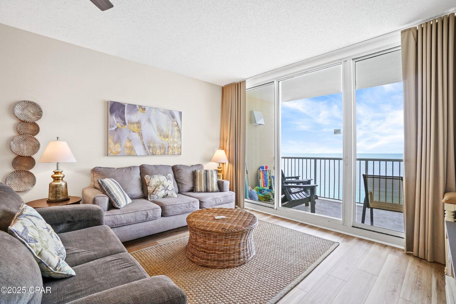 Exceptional Gulf-Front Condo with Impressive Rental Income at the ever-popular Majestic Beach Resort! This beautifully appointed Gulf-front condo offers the perfect blend of luxury, comfort, and unbeatable rental potential. Contact the listing agent for a detailed rental report. Living like a beach house but with all the conveniences of condo ownership, this one-of-a-kind property is fully furnished, completely stocked, and 100% rental-ready. High-quality furnishings, elegant window treatments, and captivating artwork set the stage for a relaxing, stylish retreat. The open floor plan and 9-foot ceilings provide a sense of space and light, allowing for breathtaking Gulf and sunset views from the living room, dining area, kitchen, and master suite ensuring you're constantly reminded of the beauty just outside your door.. Step out onto the generous, private balcony to take in the vibrant sunsets, the perfect way to end a day in paradise. New LVP flooring throughout, fresh paint, and smooth ceilings enhance the condo's modern, fresh feel. The spacious master suite is positioned front and center with direct access to the main balcony, offering unbeatable Gulf views. The en-suite bath features a luxurious jacuzzi tub, separate shower, and a large walk-in closet. The second bedroom is generously sized, easily accommodating a king-sized bed, perfect for family or guest stays. The third bedroom features a twin-over-twin trundle bed. This property comes 100% turnkey, allowing for immediate rental income with no hassle. Meticulously maintained and thoughtfully updated, it's a rare find in the highly sought-after Majestic Beach Resort. Enjoy the good life at Majestic Beach with an unparalleled deck of resort style amenities including: 650 linear feet of sugar white GULF FRONTAGE, Four Large outdoor pools (2 at Tower I and 2 at Tower II), Two Indoor heated pools (one in Tower I and one in Tower II), Two hot tubs, Baby pool, Wading pool with waterfall, H20 Bar and Grill serving Gulfside/Poolside lunch and dinner, Large outdoor dining area, State of the Art Fitness center with steam room and sauna, 130 seat Stadium seating Movie Theatre, Convention center, Private Owner's Lounge with full Kitchen, Tennis Courts, Majestic Market featuring Starbucks coffee. Quick distance to the wonderful shopping, dining and entertainment at Pier Park. FROM THIS CONDO, YOU ARE WITHIN STEPS OF EVERYTHING YOU COULD EVER WANT AT THE BEACH! Whether you're looking for a vacation home or a high-performing rental property, this condo delivers on all fronts. With luxury amenities, a prime Gulf-front location, and outstanding rental income potential, it's potentially the ultimate beachfront investment.