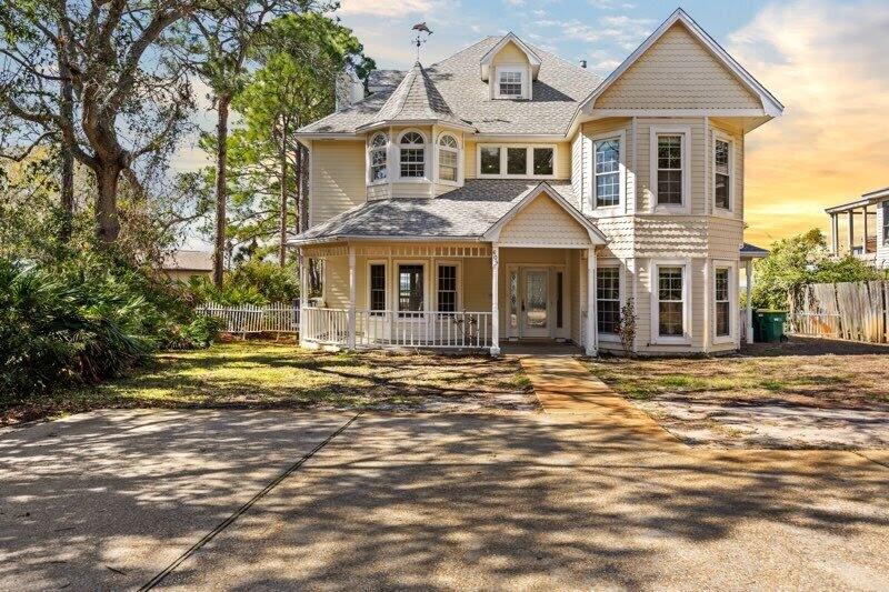 ***Back on the market, no fault of the seller*** Discover Destin's hidden gem, where coastal elegance meets ultimate privacy on a rare bayfront lot just under 1 acre in size. Nestled among lush, mature trees, this expansive property offers a serene escape with 85 feet of private waterfront along Choctawhatchee Bay. With no HOA restrictions, you have the flexibility to renovate, expand, or even build your dream waterfront estate, a truly unique opportunity in one of the most coveted areas of Destin. This spacious 3,524 sq. ft. home features six bedrooms and five and a half bathrooms, making it perfect for large families, vacationers, or those who love entertaining. The primary suite is a peaceful retreat, complete with a private balcony overlooking the water so you can watch the gentle waves every morning. In addition to the primary bedroom, the remaining five bedrooms are all extremely spacious. The expansive two-level outdoor deck is ideal for hosting guests or unwinding while watching stunning sunsets. A private dock extends into the bay, offering direct access to the Gulf, perfect for boating, fishing, paddleboarding, or simply enjoying waterfront living. Imagine launching your boat from your backyard and cruising to Destin Harbor, Crab Island, or the Gulf's world-famous white-sand beaches in minutes.

This property's secluded, forested setting ensures unparalleled privacy, a rare find in such a prime location. With nearly an acre of land, there's ample space to create your custom outdoor oasis, whether you dream of a resort-style pool or building a new custom property. Schedule your private tour today; opportunities like this don't come around often!