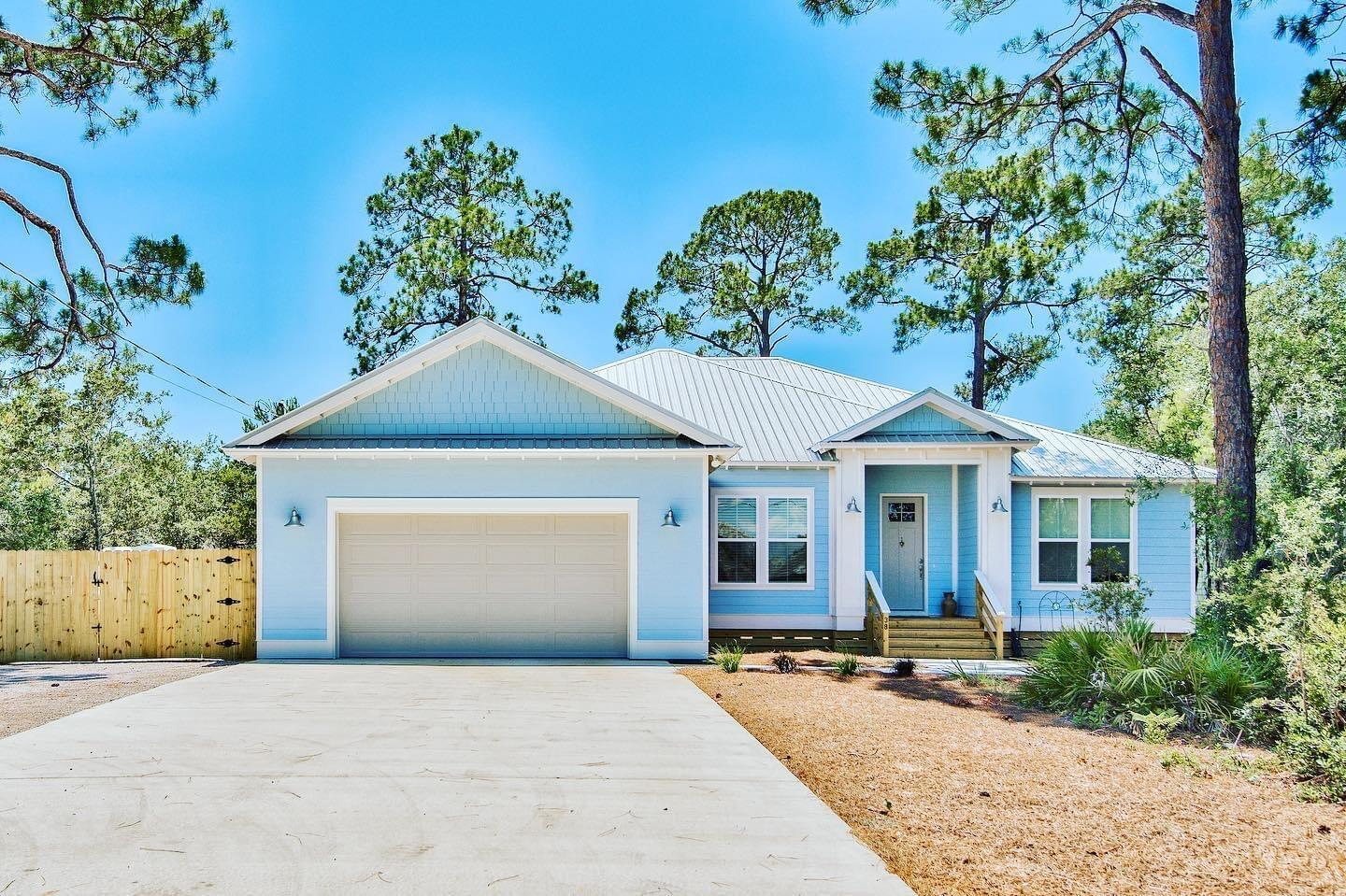 Custom built home with cement siding, metal roof and many upgrades on a large lot. Open living area with a split bedroom design and one bedroom/office off of the living area. Hardwood floors throughout, tankless water heater, quartz counter tops, large island and a walk in pantry complete with wiring for a microwave and coffee pot, all stainless appliances including a gas stove. 12x24 ft. screened in porch that over looks a fenced wooded backyard complete with a cozy fire pit and a 12x24 shop that is insulated and air conditioned. There is a 96 ft gravel area for boat or RV parking as well as a vehicle gate. Tall ceilings and can lights throughout, trey ceilings in the master bedroom and living area. A lot of love and care went into designing and building this home...make it yours.