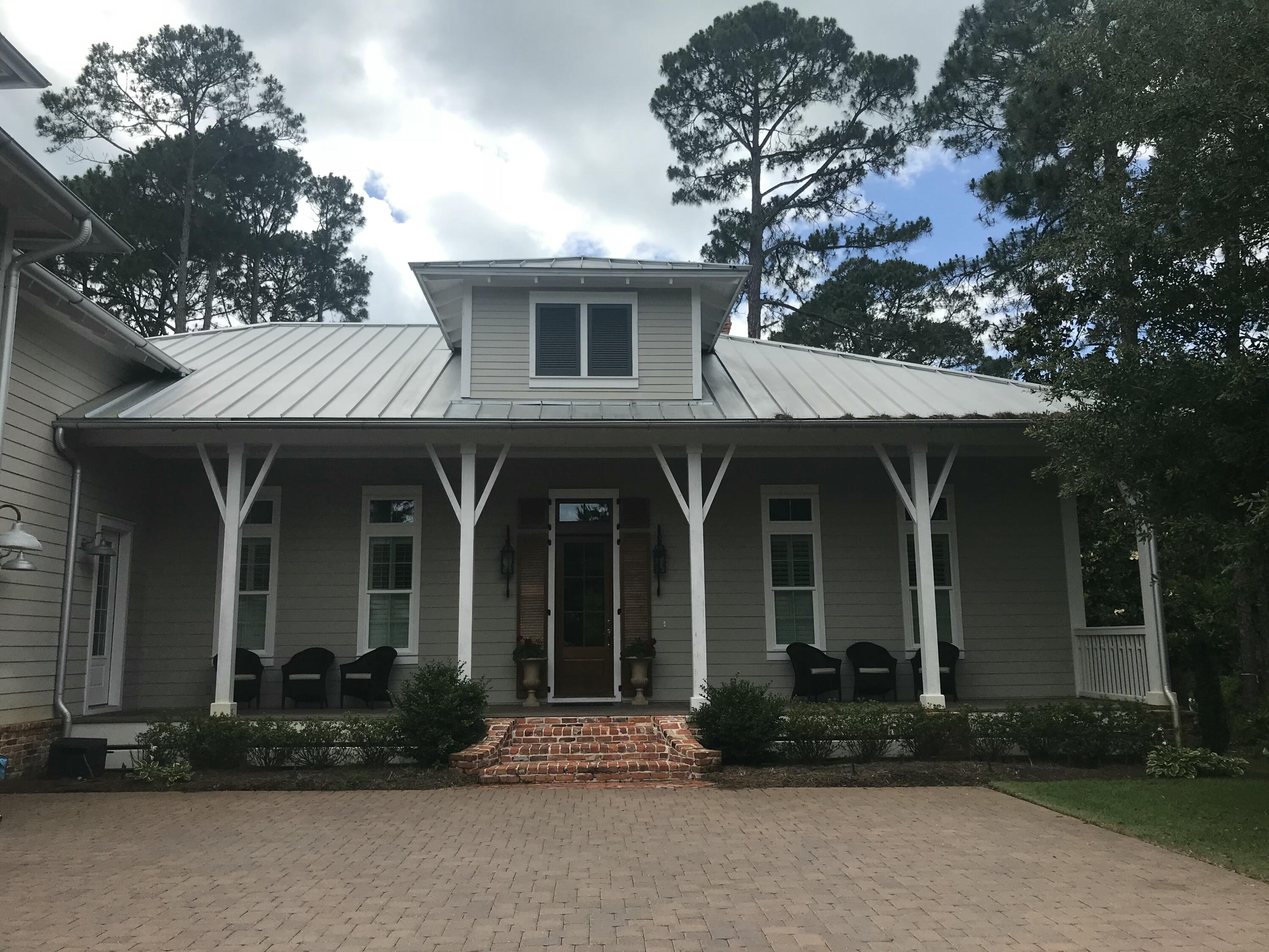 Additional pictures forthcoming. This magnificent custom-built home located in the quaint subdivision of Sea Dunes is worth consideration. Located within walking distance of the beautiful Emerald Coast along Scenic Hwy 30A, the home sits on one of the largest lots on a cul-de-sac offering privacy, peace and quiet.
As you enter the home notice the domed ceiling and special wood inlay floor pattern in the foyer. The study to the left has ample built in cabinets/shelves and a coffered ceiling. Rustic white oak floors are throughout. The first floor has an independent HVAC system. Additional features on the first and second floor include: "A large master suite featuring a bedroom with beamed ceiling, large walk-in closet and bathroom with double vanities, shower, and freestanding soaker tub. The suite has its own HVAC system.
"A large wide-open family area offers ample space for the living room, dining area and kitchen. Notice the built-in cabinets/shelves, sound system, masonry fireplace with gas starter and 12ft beamed ceilings. 
"A guest bedroom room, full bathroom, and walk-in closet
"Powder room
"Laundry room 
"Walk out to the attached garage with space for 2 cars and a golf   cart.

The guest suite on second floor has with its own HVAC system includes:
"A living area with a built-in king size Murphy Bed, loft play         area, closet, kitchenette with sink, microwave, and mini         refrigerator, 
"A bedroom with a large closet
"A full bathroom

Additional features of the house include:
"Central vacuum throughout
"Built-in pest control system (contract required for pest service)
"Plantation shutters 
"Most furnishings convey (list available)

Enjoy sitting and relaxing on the very large front porch or screened in back porch. This home will be an excellent primary residence or second home in move-in condition.