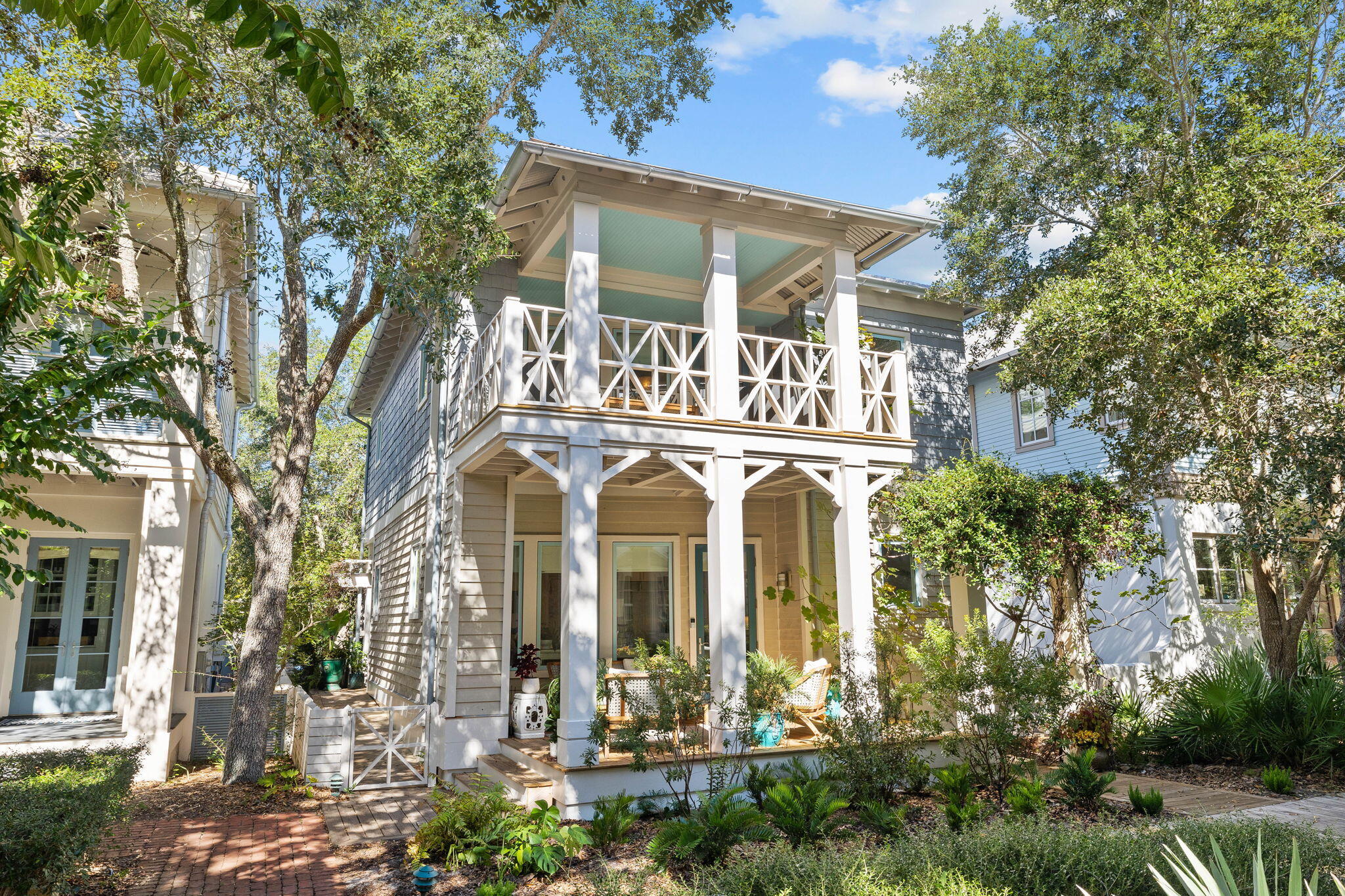 Architect Michael A. Piazza, designed this classic Caribbean cottage for the corner lot on the Kingston Pocket Park in Rosemary Beach, just steps from the Butterfly Garden, Owner's Pool & Pavilion, and the Dog Park all within a walk of 5 minutes of the Town Center. The exterior is a combination of three types of siding, two types of metal roofs, giving the appearance of a small Caribbean cottage that has been added onto over time. Renovated to add a 1st Floor Primary Suite with extensive closet, half bath for your guest, entertainers dream kitchen with high gloss white custom cabinetry, matt black custom island with 43'' Kohler workstation sink/cutting board, KitchenAid French Door Refrigerator & Dishwasher and 5 Burner Dual Fuel Thermador Convection Oven/Range all overlooking the living dining room. Up the stairs, with its cable railings, the tv loft with two twin built-in bunks along with the 2nd floor primary suite and guest bedroom with hall bath make room for all of your friends and family. Perfectly placed on the Kingston pocket park, over 550 sq ft of covered porches upstairs and downstairs provide multiple places to relax. Off the back of the house is a covered sitting area with lighted grilling pergola, enchanting courtyard with firepit and the two-car garage with Carriage House. The Carriage House, "In the Present" has been a favorite of the friends & family along with the many VRBO guest. With its vaulted wood planked ceilings, hardwood floors, King Bedroom, laundry and kitchen with full size appliances, pantry, and island. Rosemary Beach is a premier destination with its vibrant Town Center, families biking together, unique shopping experiences, award winning dining and nine private gateways to the sugar white sand and the Emerald waters of the Gulf of Mexico. Rosemary Beach Cottage Rental Company projects a Gross Rental Revenue of $200,566.