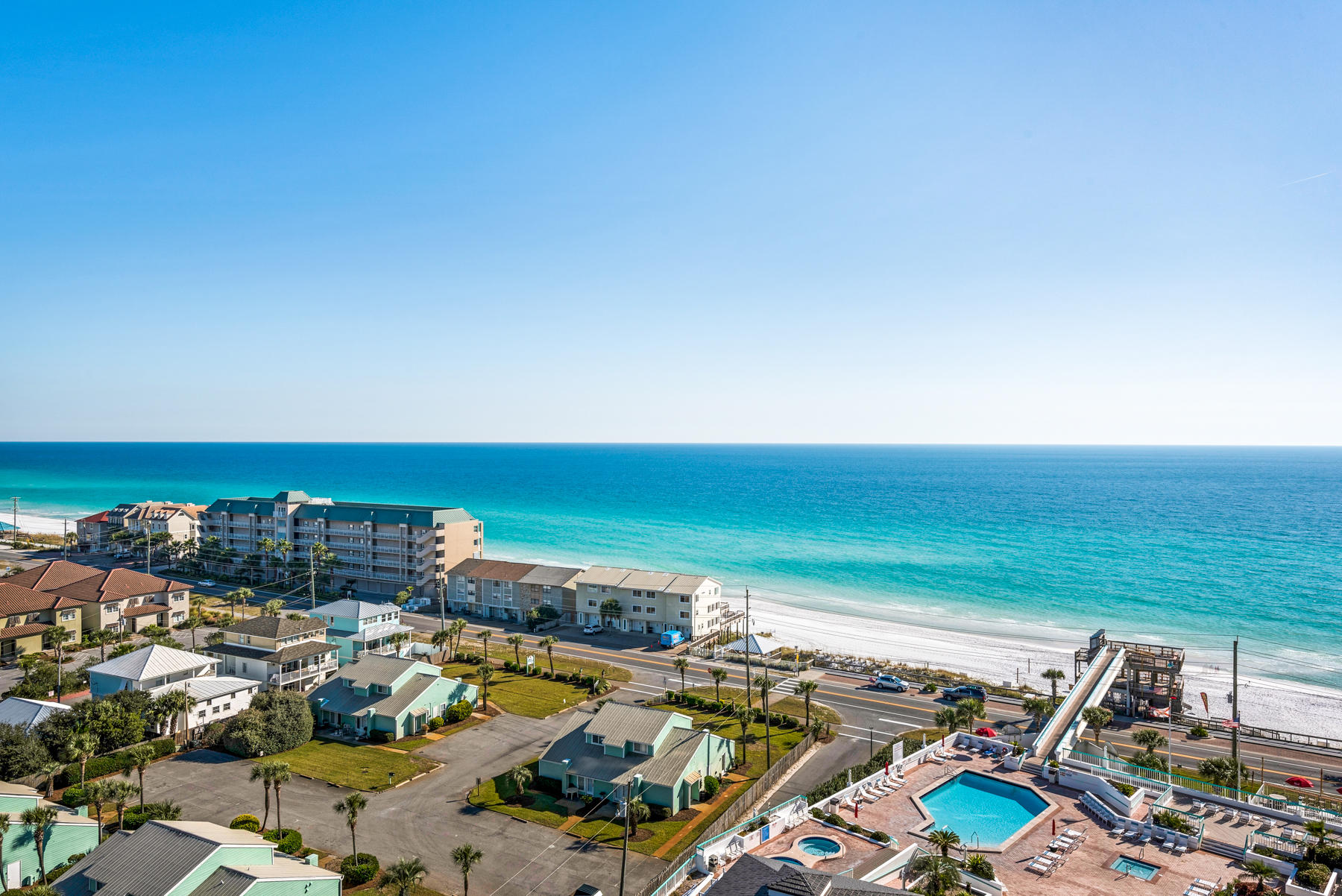 As soon as you step in to this beautiful unit you can feel the stress of every day life just immediately drift away. So much interior space to breathe, tons of balcony space, best of all the views of the white sand and beautiful emerald waters are never ending. Entertaining is a joy as well in the nicely updated kitchen with newer cabinets, granite countertops and stainless appliances. This unit has crown moulding throughout and 20X20 ceramic tile in living areas. It's bathrooms have been updated with ceramic tile shower/bathtub surrounds. As a bonus for investors...you may choose to rent the entire condo as a 3 bed/3 bath, or separate the rentals into the studio space with its' private balcony and the lovely 2bedroom/2bath space. Surfside Resort is known for its' walk-over bridge to for easy access to the beaches! Yet it offers everything you could want onsite: from the pool and hot tubs, to tennis courts and a basketball court, the Royal Palm Grill, hair salon, massage spa, beach bar, fitness room, and more! This is another one you have to see for yourself to believe all this one has to offer!  **2018 Rental Revenue = $35,468 2019 Rental Revenue = $37,875** Call your agent today!!