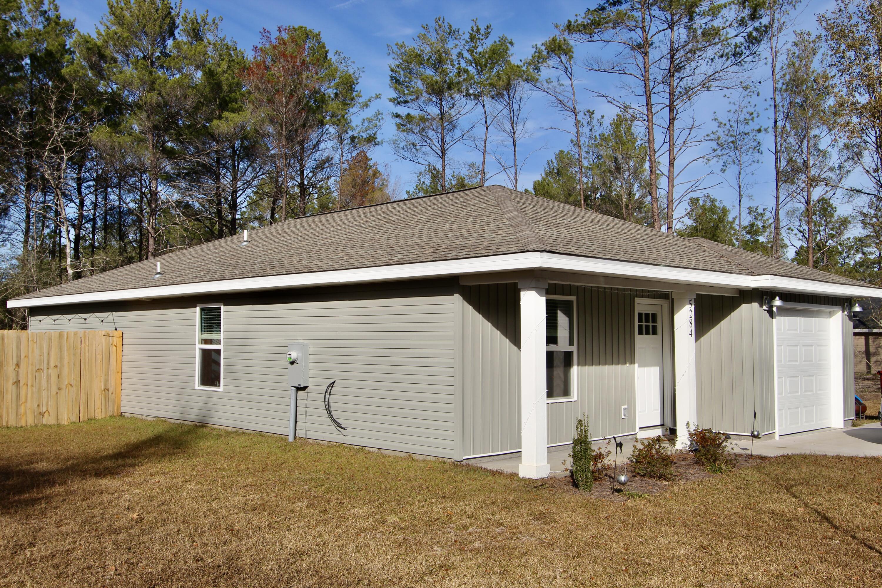 The home features LVP throughout. The kitchen is open to the living room and features an island, stainless steel appliances, white tile backsplash, granite counter tops and an under mount sink. The spacious master bedroom can hold a king size bed! The master bath has a walk in closet and the bathrooms also have granite counter tops! Fenced in backyard.