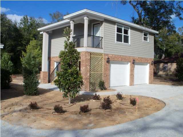 Upscale 2 bedroom home with an oversized 2 car garage! Located across the street from Boggy Bayou in Niceville. Elegant amenities include beautiful hardwood floors, granite countertops in kitchen, white appliances, carpet in bedrooms, ceiling fans throughout, lots of storage, washer/dryer hookup and plenty of exterior lighting. Come be the first to call this home. This is one of two homes built on this lot. Do you have toys that need to be kept out of the elements? If so, this home is for you. Family park just a few blocks away with pavilion/Gazebo, picnic tables, restrooms/changing room and boat ramp/parking. Contact office for details. No smoking. No pets. ~All ERA American Real Estate residents are enrolled in the Resident Benefits Package (RBP) for $35/month which includes HVAC air filter delivery (for applicable properties), credit building to help boost your credit score with timely rent payments, $1M Identity Protection, utility concierge service making utility connection a breeze during your move-in, our best-in-class resident rewards program, and much more! More details upon application.~
