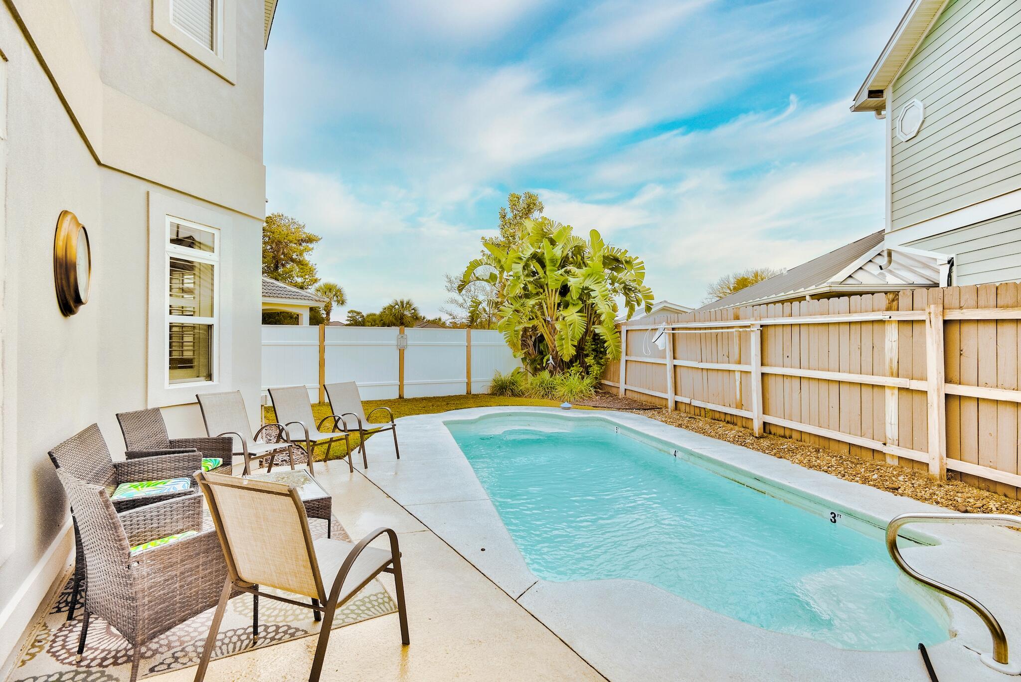 This fully furnished, 3,092 square foot, 4 bdr + bonus room/4 bath beach home offers deeded beach access, private pool, and a 2 car garage! Renovated from floor to ceiling, this gorgeous home is turnkey. Walk inside and a wet-bar welcomes you into a spacious and very open great room. A dual fireplace leads to gorgeous white granite kitchen, stainless steel appliances, and dining area overlooking backyard pool. The 1st level also offers a full bath perfect for showering off after a day at the pool or the beach. The spacious second level includes a large loft at the top of the stairs, 4 bedrooms + a bonus room with balcony currently being used as a 5 bedroom! The fenced-in back yard features a heated pool, perfect for guests and family gatherings. Terra Cotta Terrace is located off central Scenic Hwy 98 and offers a deeded beach access, tennis court, and community pool. It's closely located within a bike ride or golf cart drive to several nearby restaurants as well! Come take a look at this unique and special beach home before it's gone! Buyer to please verify all information contained herein.