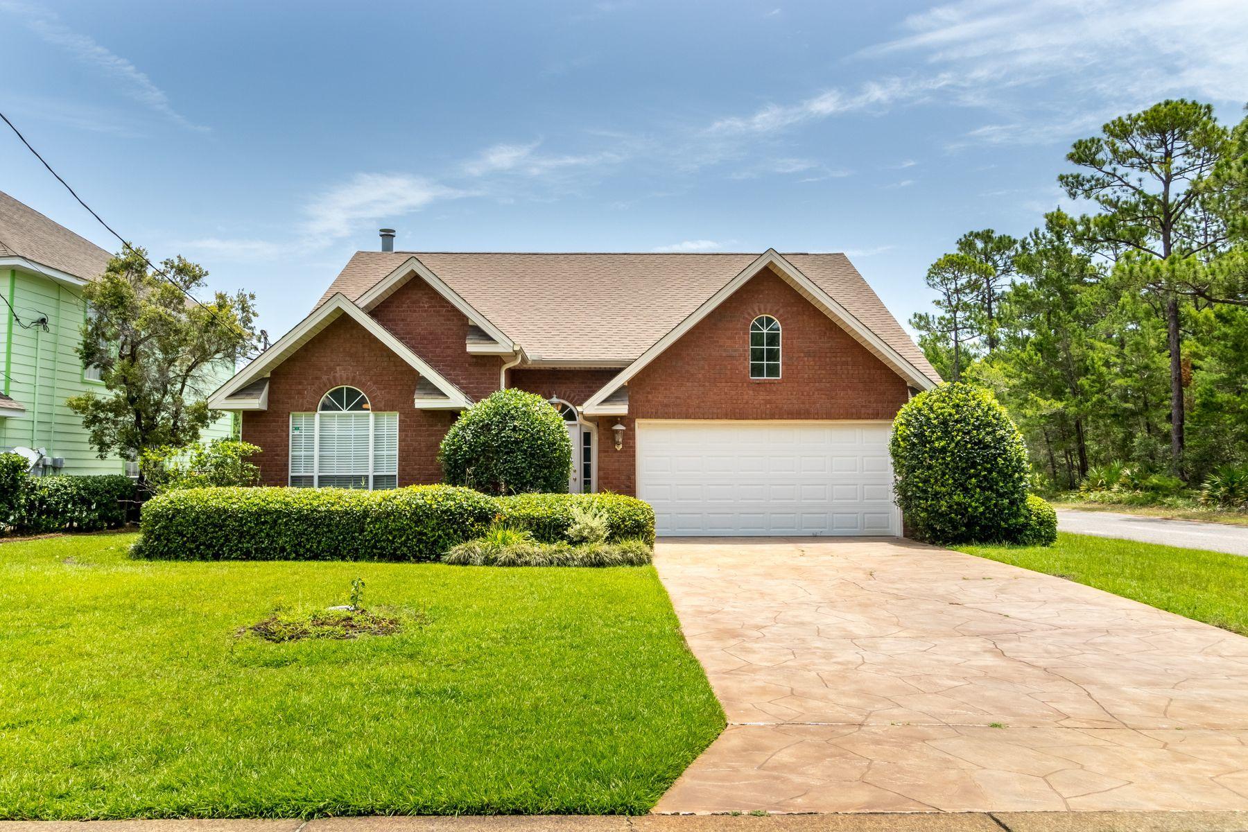 This lovely brick home has great curb appeal and is move in ready. Located on a Lakefront corner lot in Miramar Beach with NO HOA fees. With 3 Bedrooms/2 baths all on a single level, this is a smart investment as a rental property, second home or full-time residence. Key features are the 2-car garage, spacious split floorplan with kitchen, pantry, breakfast bar and dining/living spaces with vaulted ceilings. The large master bedroom has a walk-in closet, and double vanity bathroom with garden tub and separate shower, while 2 guest bedrooms share a hallway bath. Designated laundry room is conveniently located. The living space is extended outdoors by a screened porch where you can enjoy the birds and frogs singing and lily pads in bloom, or let the dog run in your private fenced back yard. Mature sod landscaping is maintained with well irrigation system. New HVAC system and hot water heater. Blocks from the Bay and a mile to the Beach, close to Silver Sands Outlet and Destin Commons restaurants and shops.