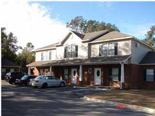 Single Unit in New Upscale Townhome Community Located in center of Niceville. Interior design is everyone's idea of a perfect place to call home. Upgraded stainless steel appliances are furnished including washer and dryer. Carpet is only in bedrooms with 18'' tile in all other rooms. Cultured marble countertops and sinks in both baths with formica counter in kitchen. Oak cabinets add to the beauty of this unit. T.V.. cable and phone line in every bedroom. Ceiling fans with lights in both bedrooms as well as family room and sun room. Storage unit, patio and privacy fence separate unit from neighboring townhomes. Within walking distance to schools, shopping, Kmart, and any other amenities you would want. Only 9 townhomes in the project, which offers a most private and quiet setting.