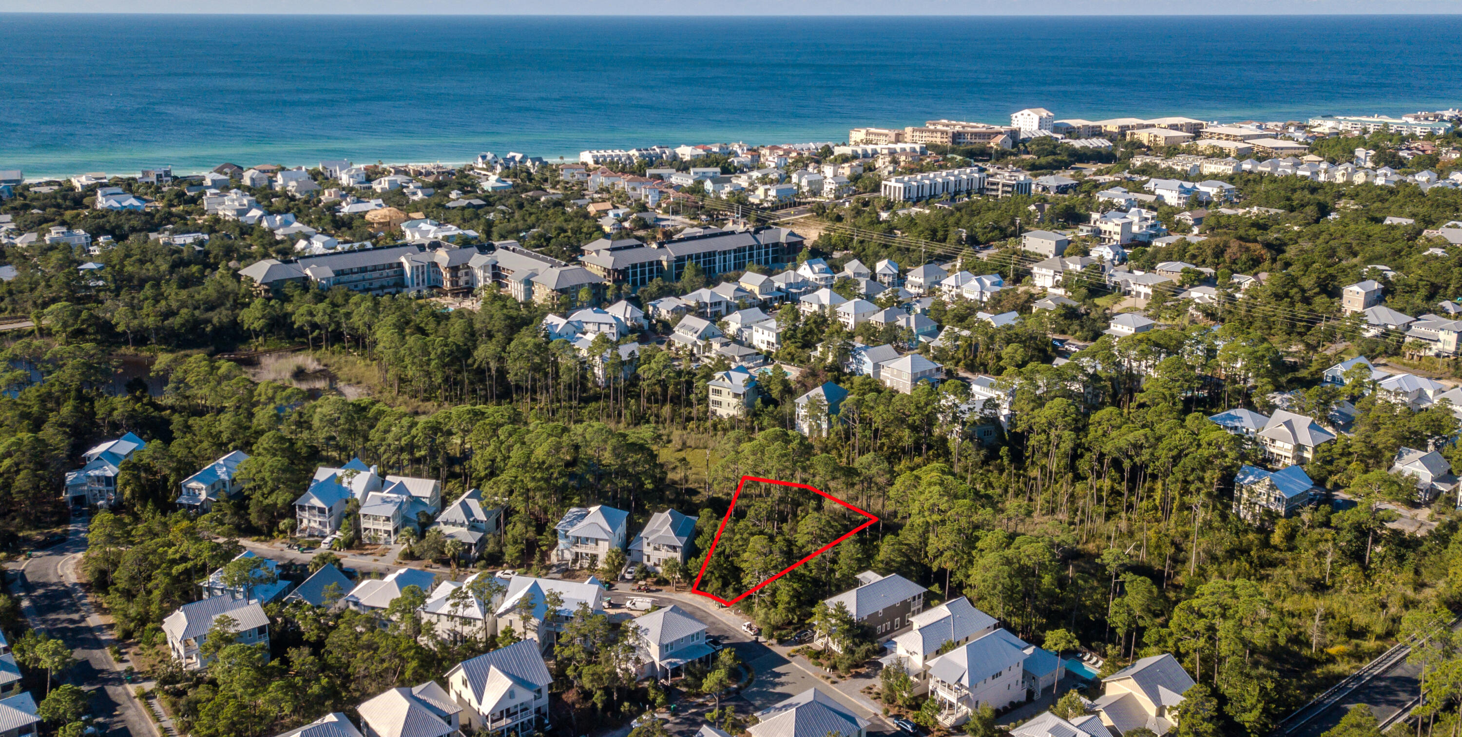 Build your dream home on this prime lot boasting over 1/2 an acre (0.568 acres) in the quaint community of Lakeside at Blue Mountain Beach just a half mile to the beach and in close vicinity to many dining & entertainment options on 30A. Capture nature right outside your door as this lot backs up to a small creek & is nestled behind Big Redfish Lake, one of the rare coastal dune lakes. Point Washington State Forest is also in close proximity & has many nature trails to enjoy. Take a leisurely stroll or quick bike ride to the Blue Mountain Beach Regional Access on Hwy 83. Lakeside is a beautiful planned community with a great community pool, playground, green space & plentiful sitting areas to appreciate along with the bridge over Redfish Lake. Serenity & convenience at this premier lot! Design guidelines allow for a 2-story house or a 2-story house with tower not to exceed 3,400 square feet. A carriage house may be built with a max of 580 feet. A Florida licensed architect is required to design the residence and homes must be submitted to the architectural review board. Build time once home is started must be completed in 24 months and the carriage house cannot be rented separately from the main house. This community allows long or short term rentals and expects to perform well due to its close vicinity to the beach & Gulf of Mexico, easy access to Timpoochee Trail (30A's 19 mile paved bike path) and all the conveniences of Blue Mountain Beach like Redfish Village, Redfish Taco, For the Health of It Market, Blue Mountain Creamery, Blue Mountain Bakery, Bike Daddy's Bike Shop, McTighes, Blue Mabel and even Grayton Beach State Park in close vicinity. The nearest public beach access is at the south end of Highway 83 just a half mile away with parking and restrooms. Blue Mountain Beach is the highest elevation of Florida's Gulf Coast lending incredible views and beautiful natural dunes and wild flowers. Enjoy the great outdoors with the surrounding state parks and kayak or paddle board on one of the rare coastal dune lakes to experience a unique ecosystem that is only available to approximately 11 locations in the world! Do not miss out on this exclusive larger lot at Lakeside.
