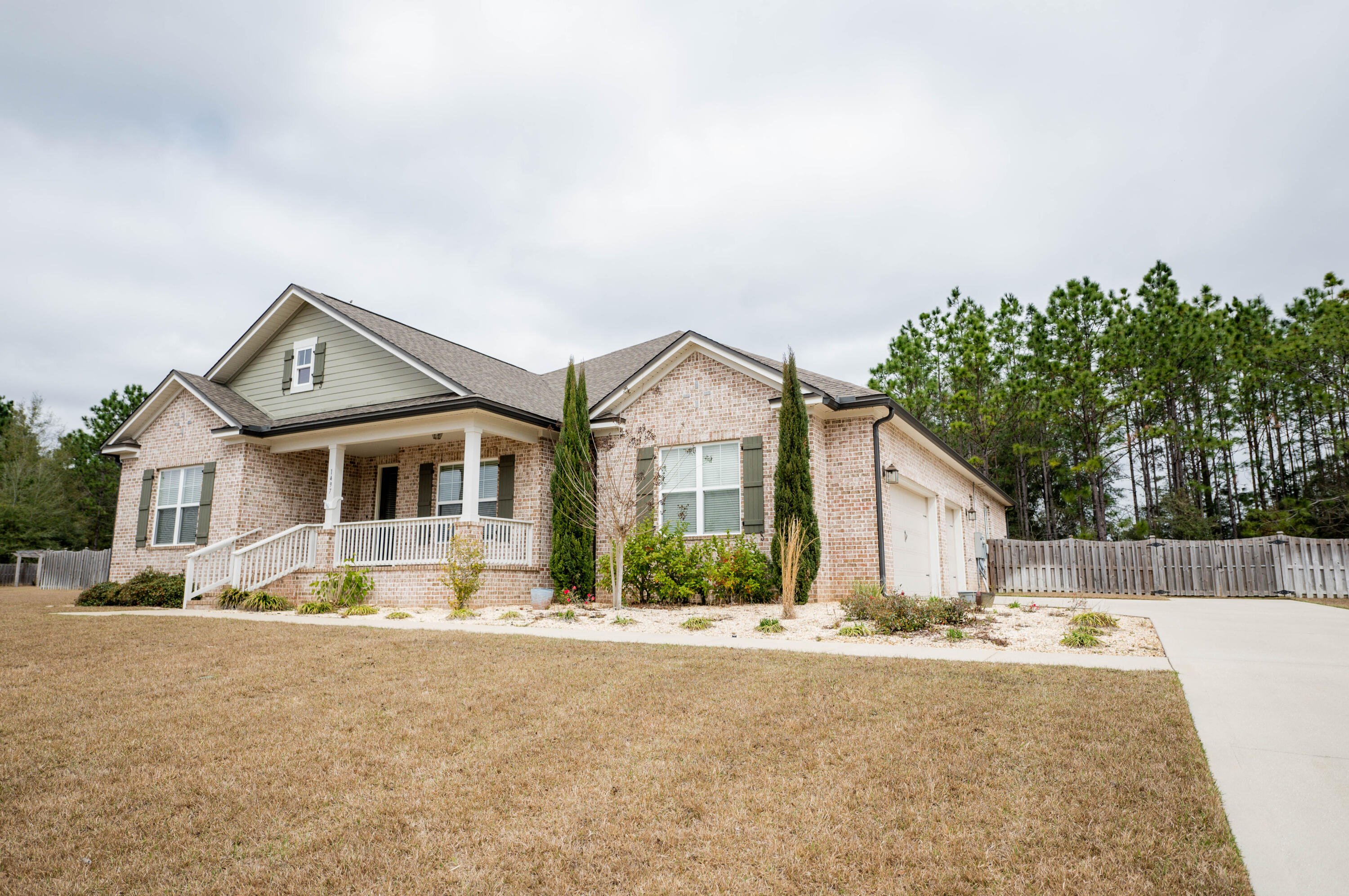 Showings begin at Open House Saturday, March 5th from 11:00 - 2:00.  Exquisite home built by Randy Wise Homes.  The home is situated on over an acre of land for plenty of room.  Gourmet kitchen is a Chef's Delight.  Professional Series Frigidaire stainless steel appliances including a double oven, cooktop, sub zero refrigerator/freezer, microwave and dishwasher all convey.  What is even move fabulous is the vegetable sink in the middle island that makes it easy for prep. Beautiful walnut cabinets with plenty of storage.  Granite adorns the counters.  The walk-in pantry has wooden shelves so nothing falls through.  The main island has a wonderful bar feature when cooking with friends. The dining room and family room is adjacent to the kitchen.  Centralized for all your entertaining needs. A wood burning fireplace with mantel and hearth is a great way to relax and enjoy the cool evenings in Florida. The French doors lead to the back screened porch and the Bahama Swim Spa.

The laundry room is directly beside the kitchen.  It doesn't disappoint for the chore that no one loves.  The space is more than you can imagine with a place to hang up clothes and to fold your laundry before putting it away.  An area for you to house your hampers, cabinets for storage, and a good size utility sink for cleaning.

The master suite has a small alcove area prior to entering this very spacious suite.  No lacking in floor or wall space.  Relax in this fabulous suite with separate double vanities with great storage, a soaking tub, and tiled walk-in shower.  The private water closet is spacious as well. Did you notice that there are 2 walk-in closets with custom shelving, just waiting for your personal belongings.

The front covered porch greets you from the street and says Welcome Home.  Once you enter the home you will notice the extra wide hallway that leads down to the kitchen. To the left and the right are entryways to the guest bedrooms and additional bathrooms.  Each little hallway has a linen closet for storage.

The flex room with tile floors is great for office space, craft/sewing or an additional bedroom.

The back screened porch leads to the Bahama Pool Spa for you to enjoy with family and friends. The screened area has a door on each side for you to get to the yard.  The backyard has a privacy fence and a gate at the back to access the additional part of the lot that is not fenced.(survey is available) The lawn is watered by a sprinkler system with timer.  A brand new Generac generator has been installed.(24 KW)

The side lanai has been screened in with an additional patio just outside for your grill or smoker. There is a lower privacy fence that separates this side yard from the backyard.  It would be a great place for yard toys or it could be used for your pets.

Extra concrete has been poured at the top of the driveway to make sure it is easy to back up from the side entry garage.  The 2 and 1/2 car garage makes it a great storage area for your lawn equipment.

Additionally there is a ring door bell installed and the UV purification system on the air conditioning system. The ceiling height is 9' throughout, 8' doors, crown molding, and cased window.