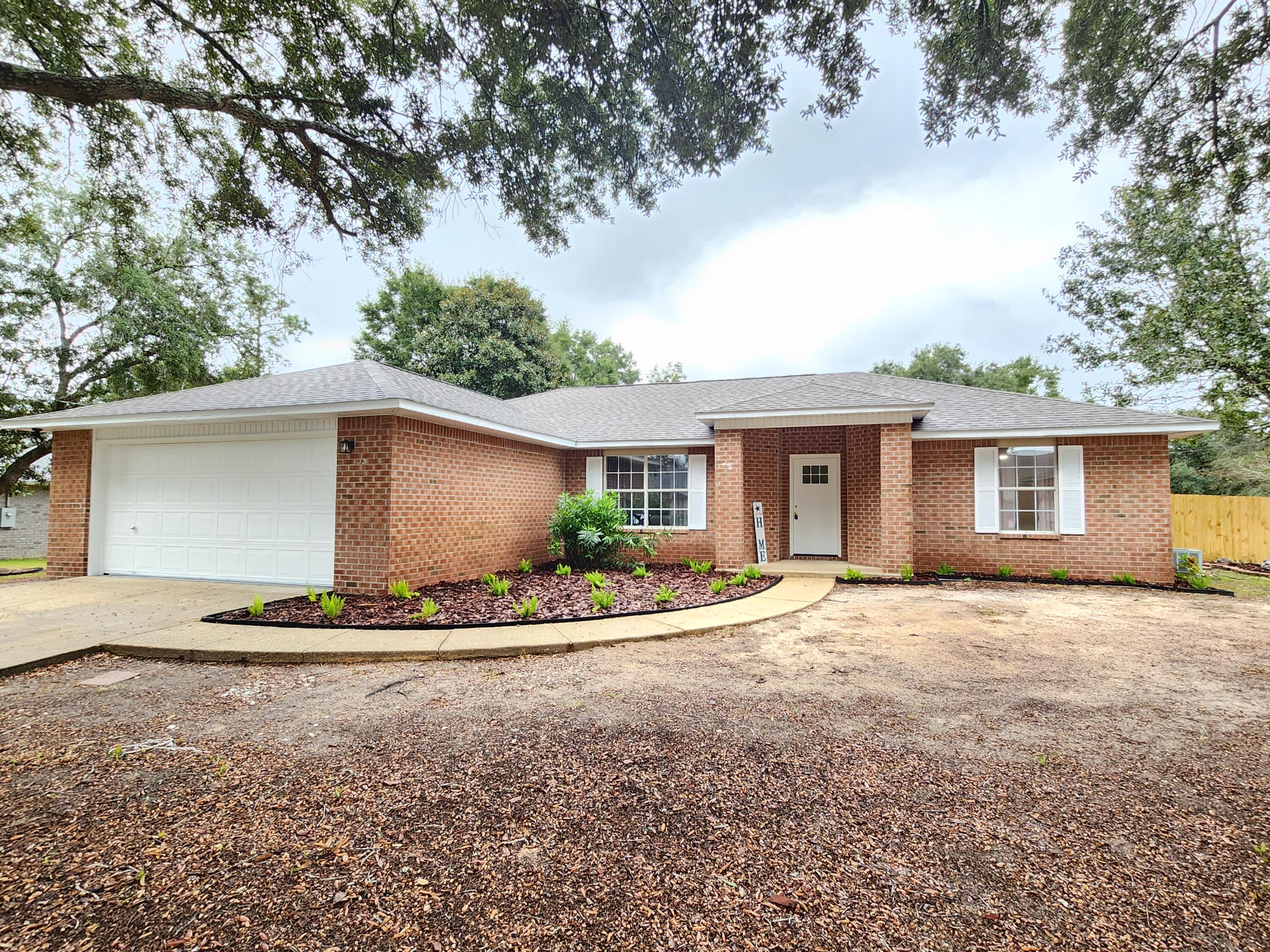 Welcome to this charming 3-bedroom, 2-bathroom home located in the vibrant city of Navarre, FL. This property boasts a modern design with vinyl plank flooring throughout, adding a touch of elegance to the space. The kitchen is equipped with top-of-the-line stainless steel appliances, ready to inspire your inner chef. The home also features convenient washer/dryer hook-ups, ensuring laundry days are a breeze. The exterior of the house is just as impressive with its durable brick siding and a spacious 2-car garage. One of the greatest advantages of this home is its prime location. It's situated close to a variety of shopping destinations and dining options, offering a lifestyle of convenience and enjoyment. This home is a perfect blend of style, comfort, and location.